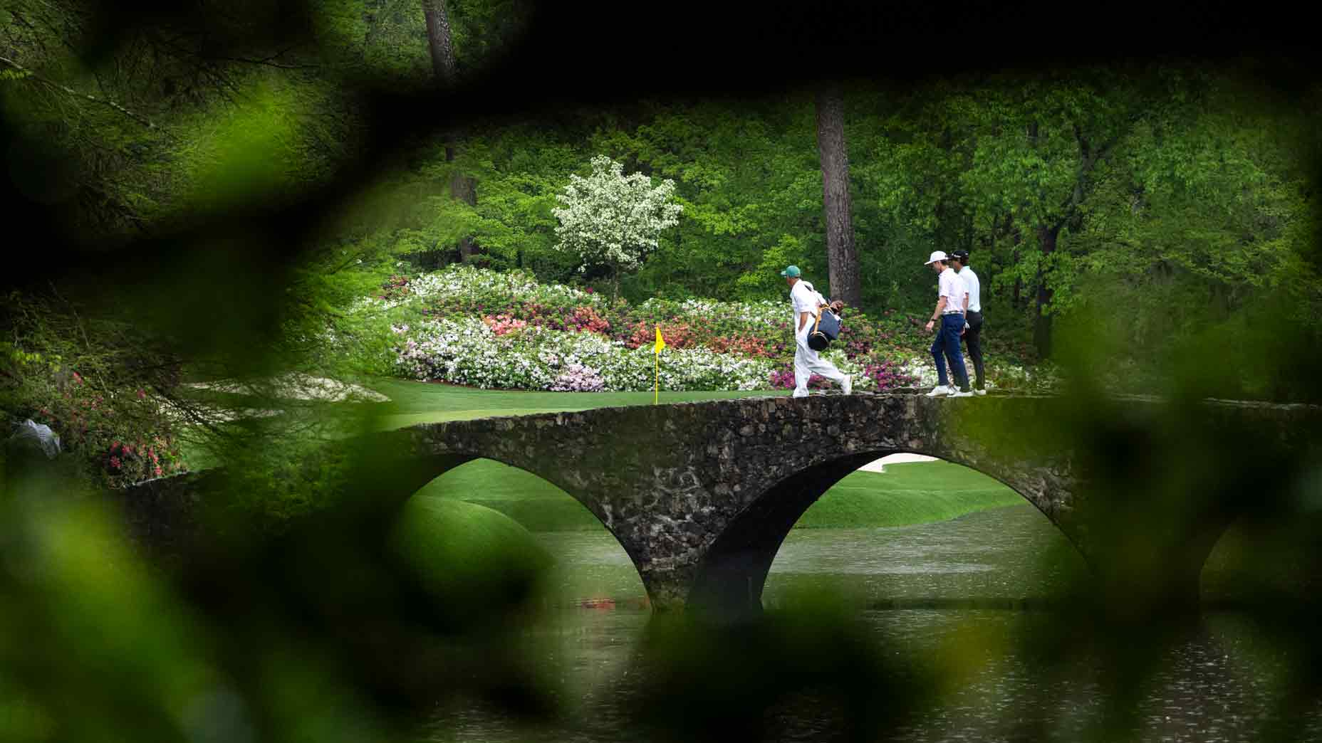 Amateur Evan Beck of the United States and Nicolas Echavarria of Colombia walk on the Hogan Bridge at No. 12 during practice round 1 prior to the Masters at Augusta National Golf Club, Monday, April 07, 2025.