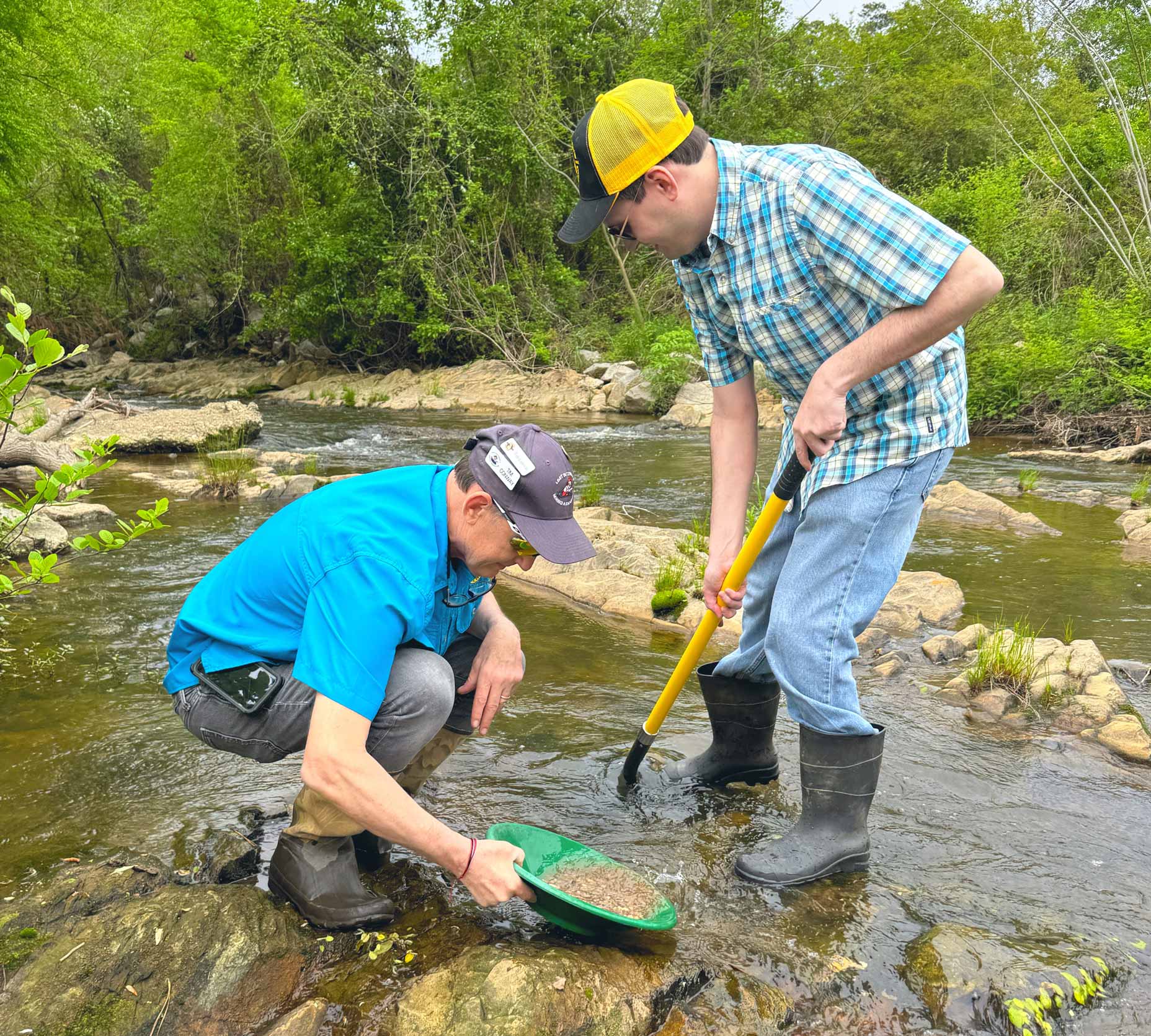 Tim Conway and his son, Bailee, in Rae's Creek.