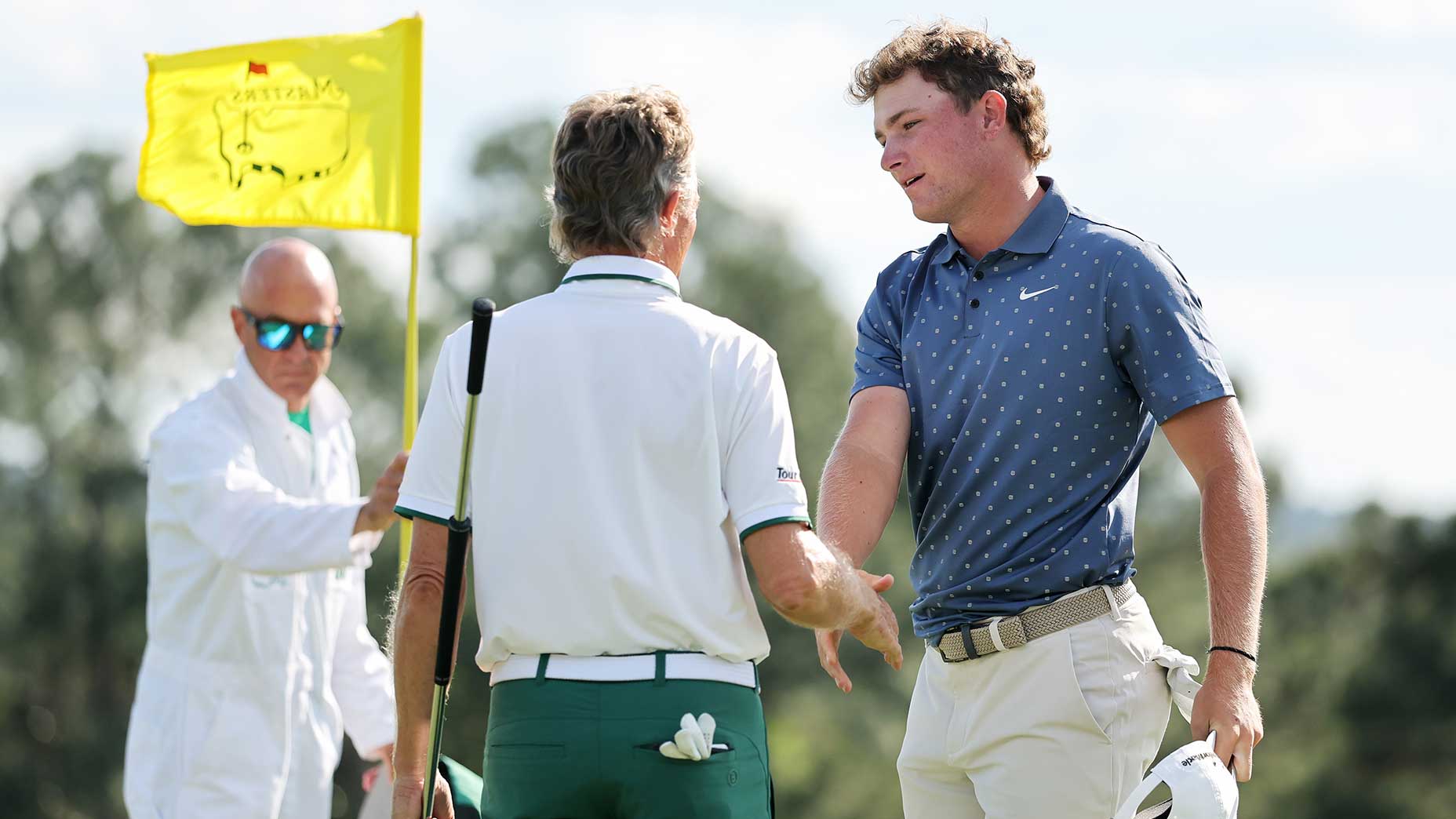 Bernhard Langer and Noah Kent shake hands following the second round of the Masters on Friday at Augusta National.