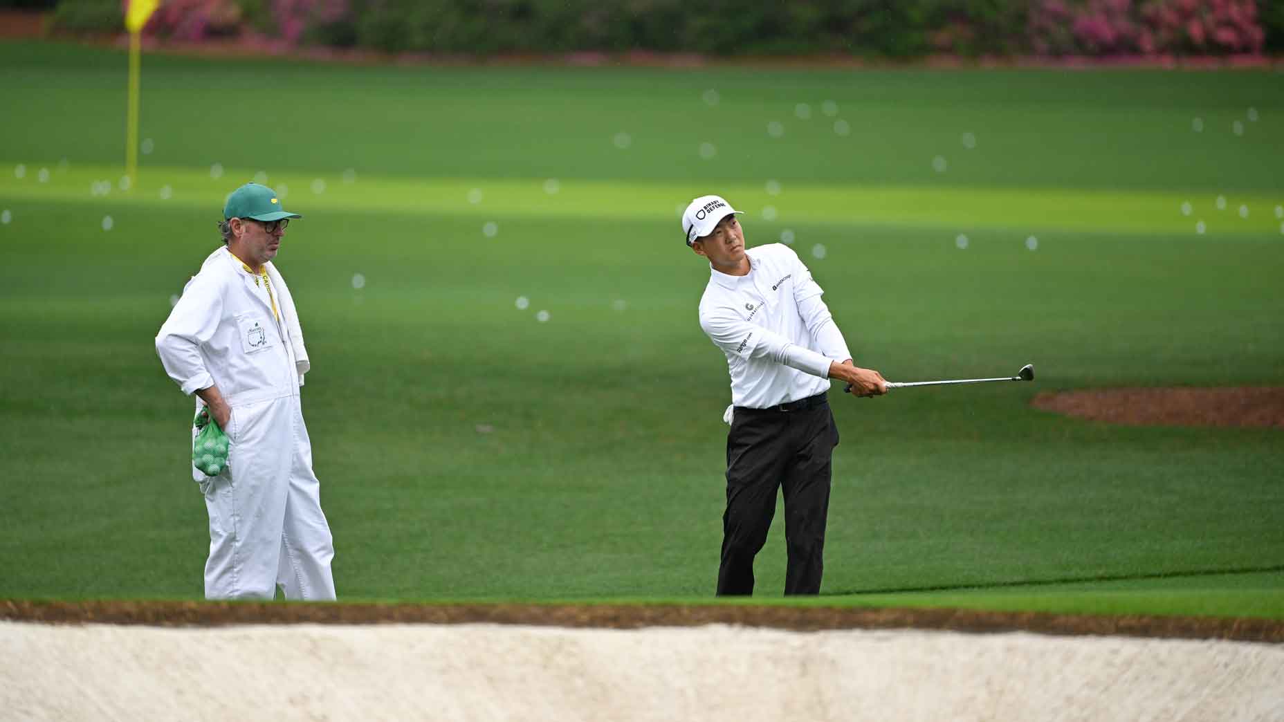 michael kim practices chipping ahead of the 2025 masters