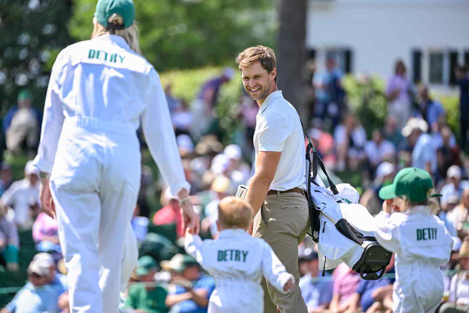 Thomas Detry of Belgium, his wife Sarah Taylor and their daughters Sophia Dolores and Alba Elizabeth smile during the Par Three Contest prior to the Masters Tournament at Augusta National Golf Club on April 9, 2025 in Augusta, Georgia.