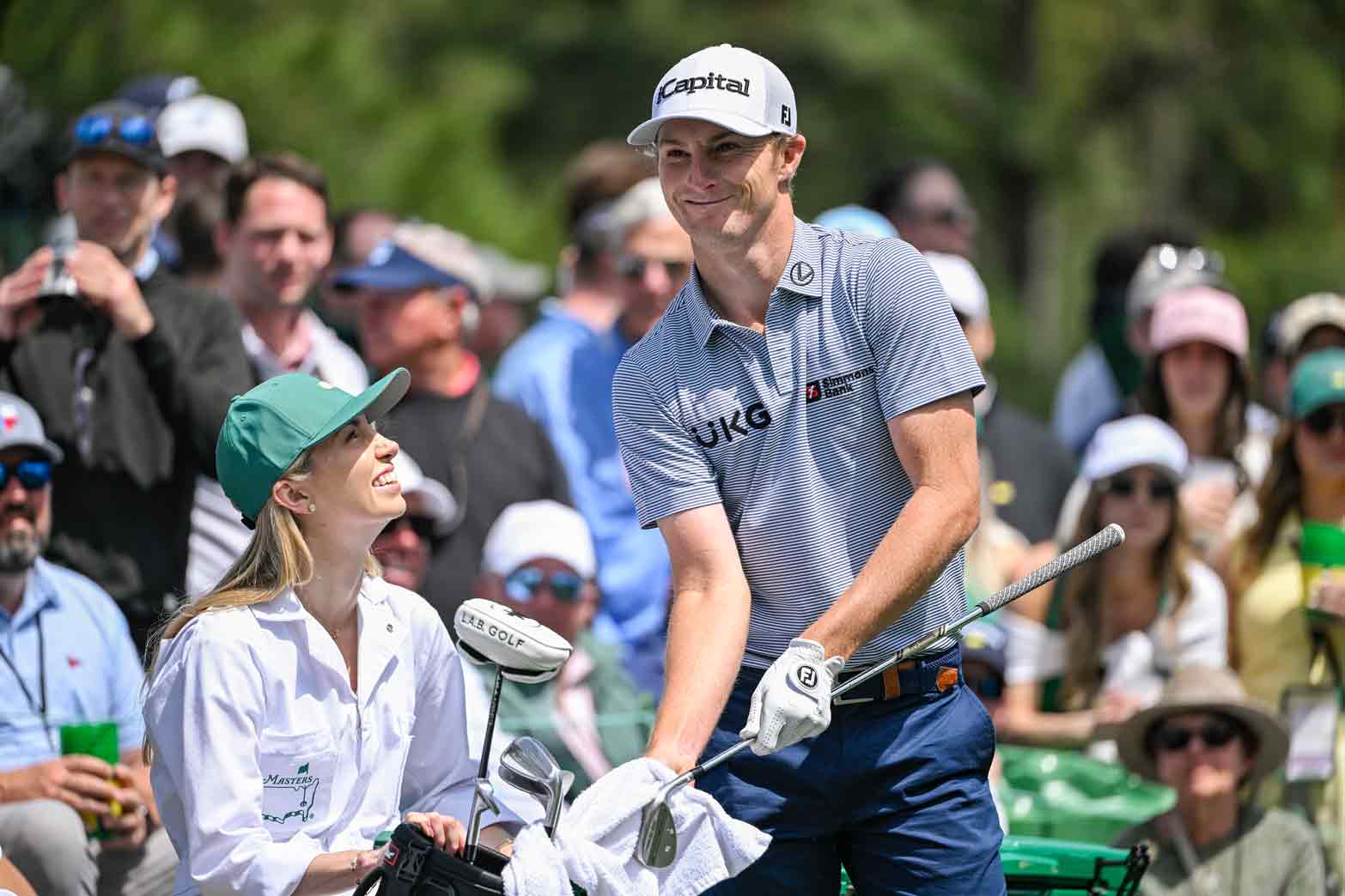 Will Zalatoris smiles with his wife Caitlyn Sellers during the Par Three Contest prior to the Masters Tournament at Augusta National Golf Club on April 9, 2025 in Augusta, Georgia.