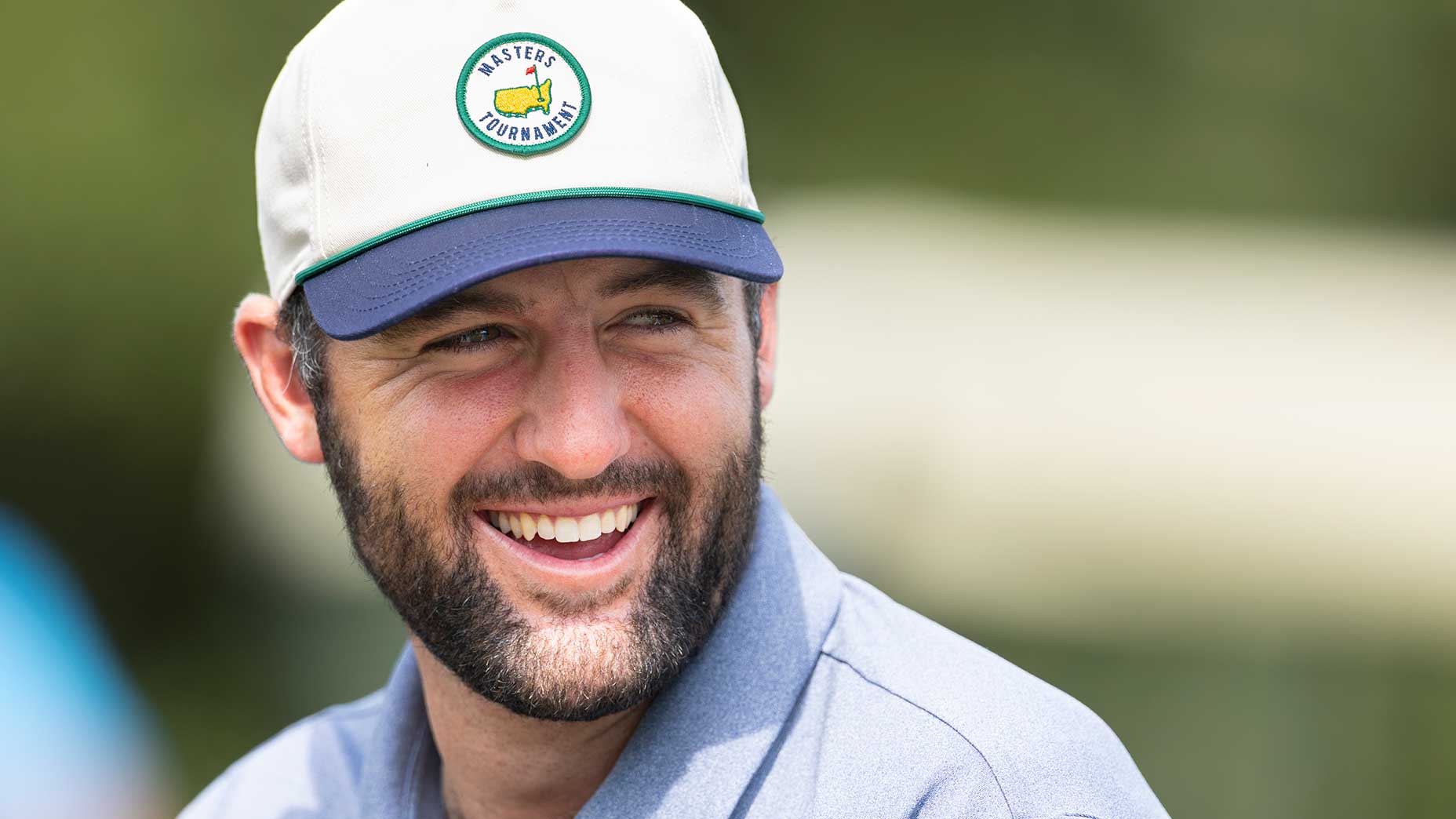 Scottie Scheffler laughs during a practice round prior to the 2025 Masters at Augusta National Golf Club.