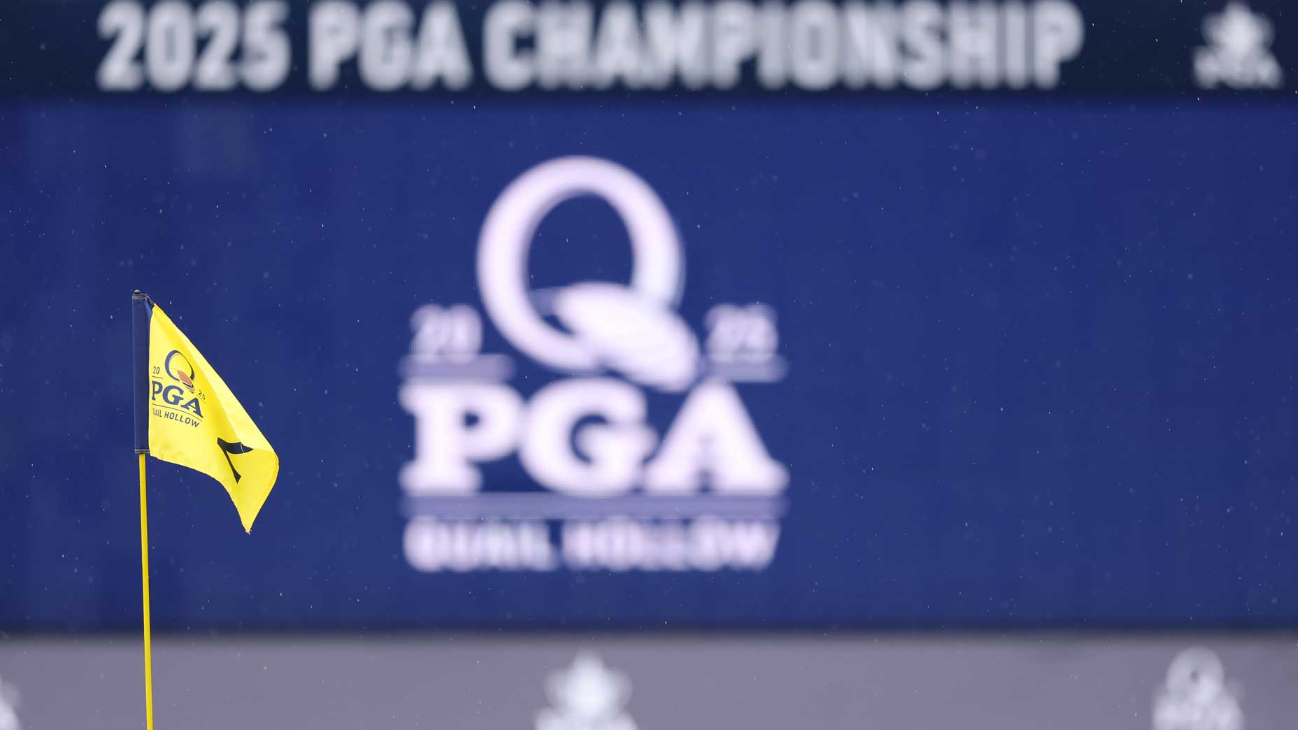 A 2025 PGA Championship flag on a green at Quail Hollow.