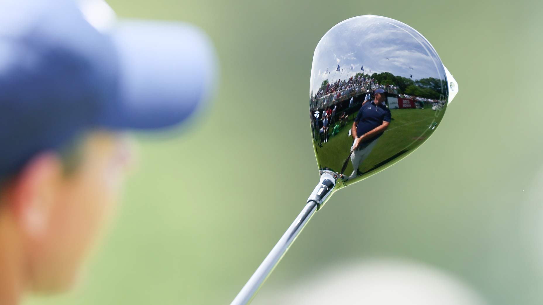 Rory McIlroy sees his reflection in his driver.