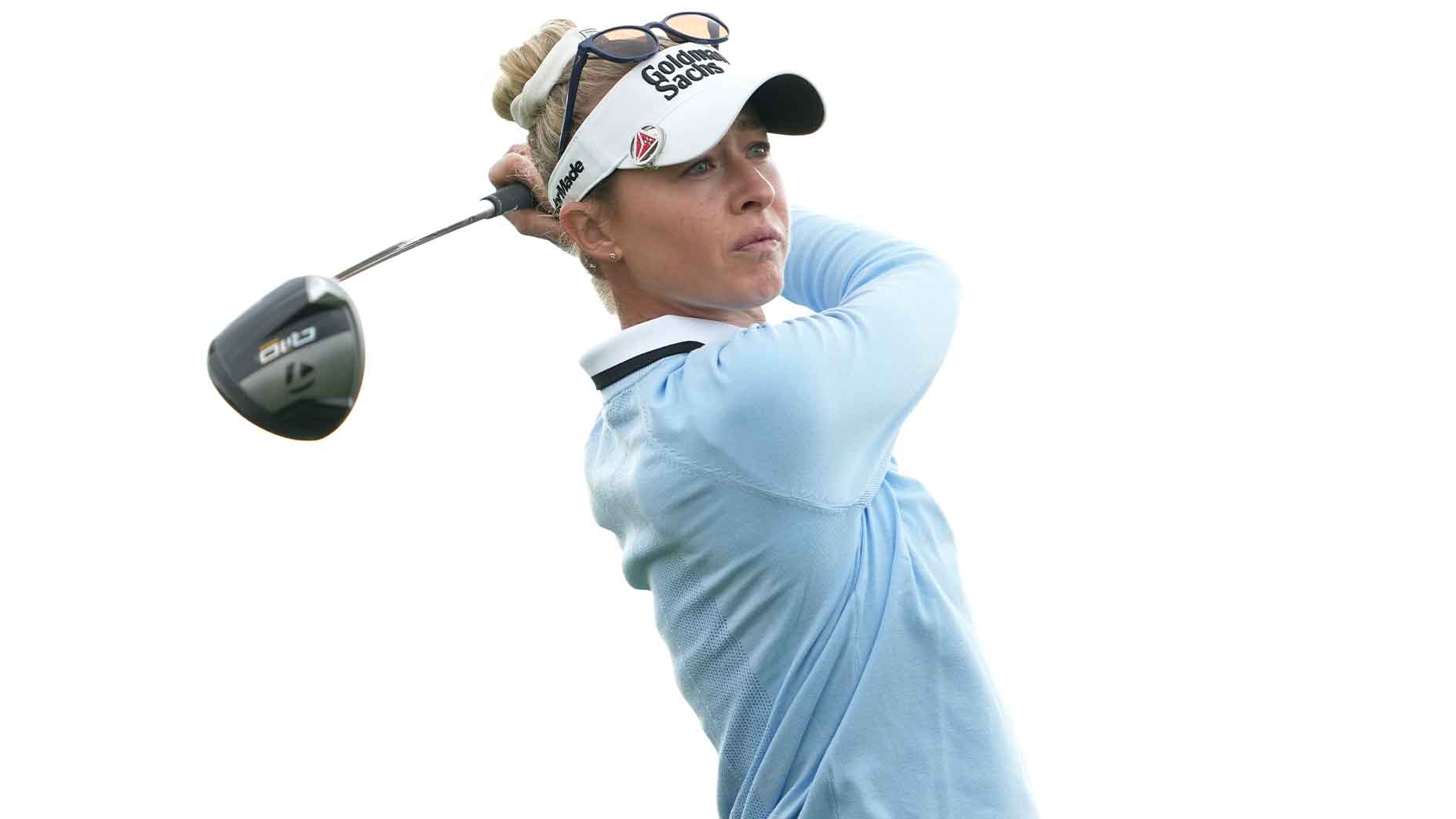 nelly korda swings driver at the u.s. women's open in baby blue shirt and white hat