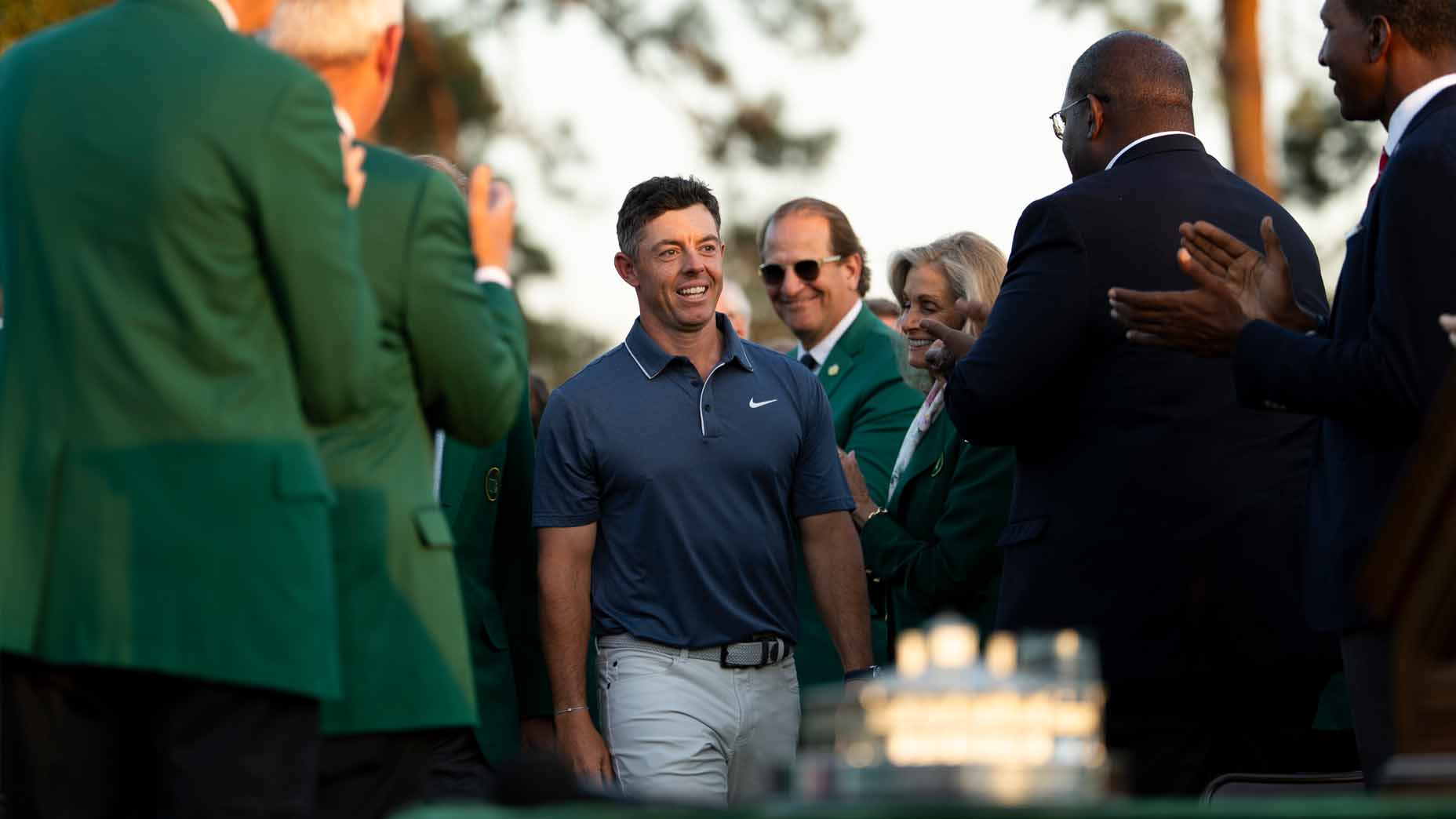 Rory McIlroy walks up to the Masters trophy after winning the 2025 Masters