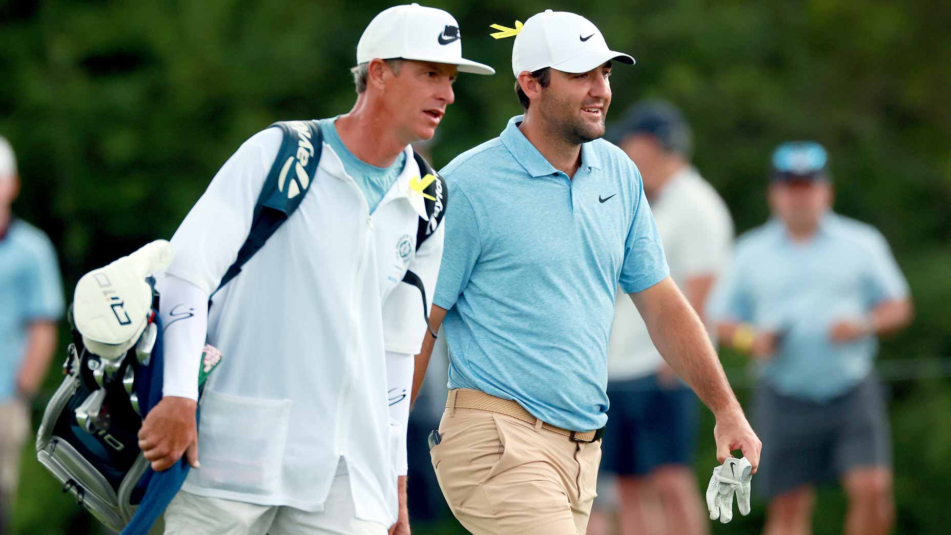 World No. 1 Scottie Scheffler, betting favorite in the 2025 Memorial odds, walks with his caddie during the Memorial Tournament.