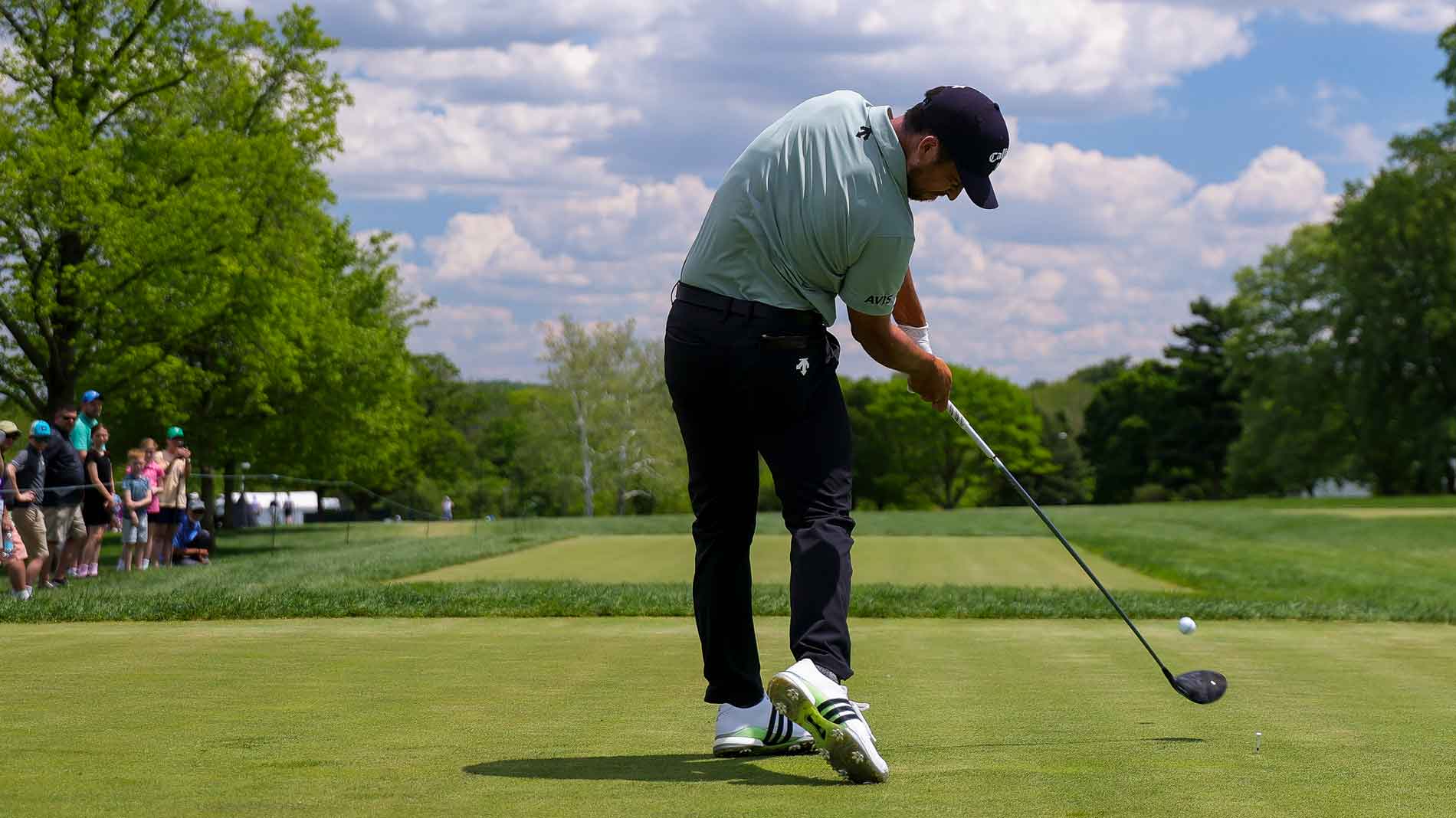 Xander Schauffele hits a tee shot on the 11th hole during the first round of the Truist Championship 2025 at The Wissahickon at Philadelphia Cricket Club