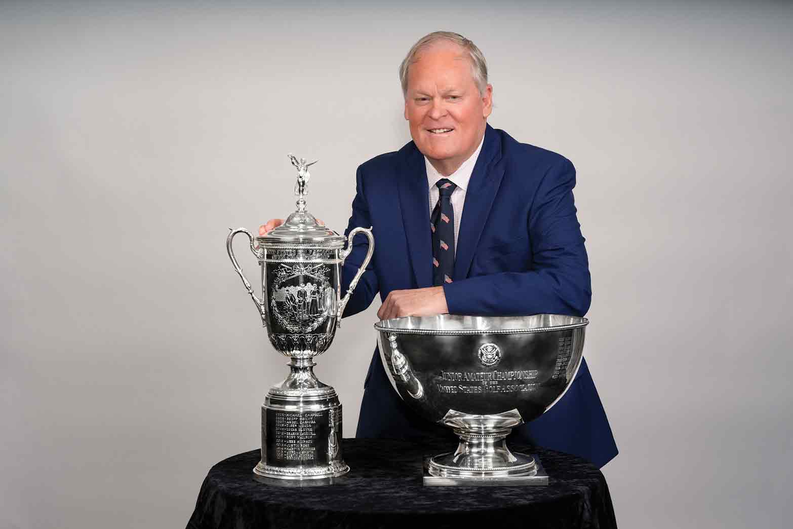Johnny Miller poses with his trophies