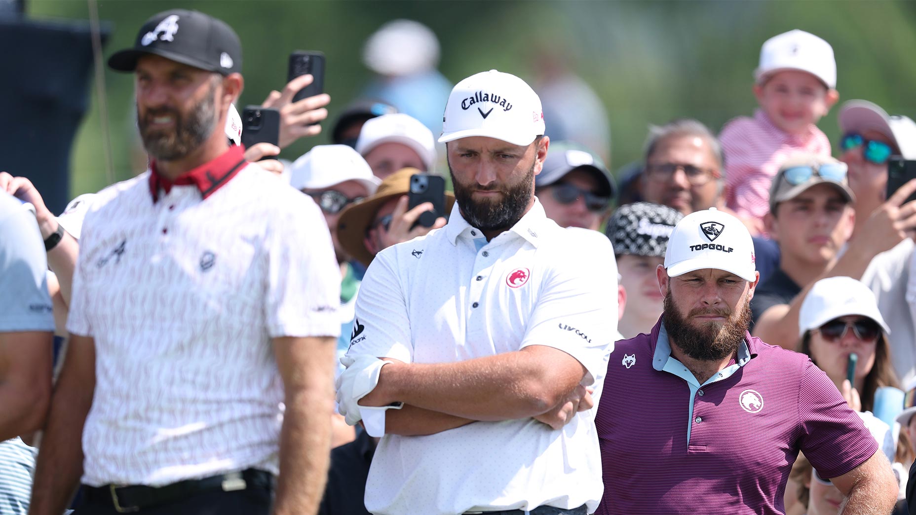 jon rahm, dustin johnson and tyrrell hatton stand next to one another at the u.s. open