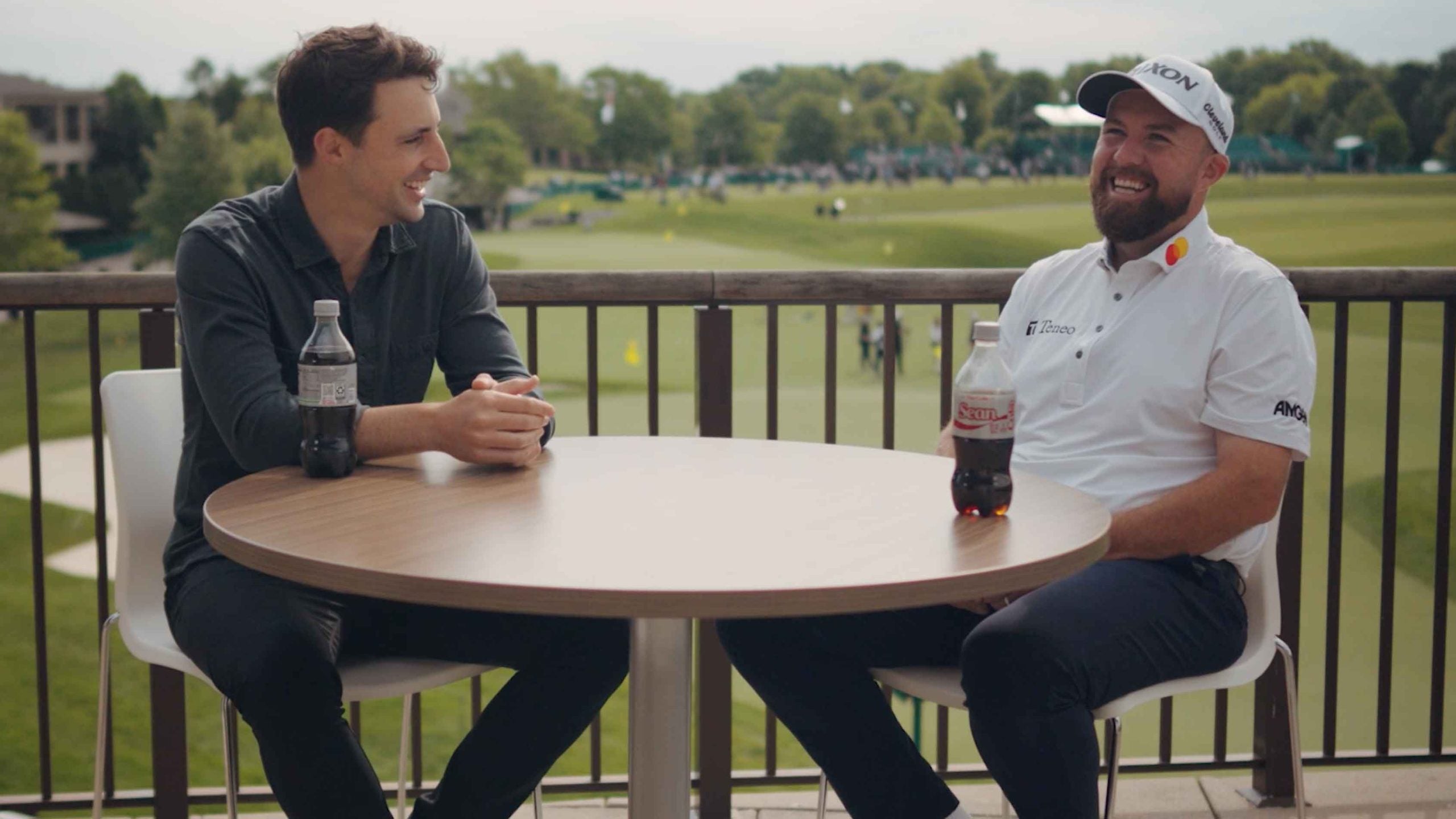shane lowry and dylan dethier talkling golf