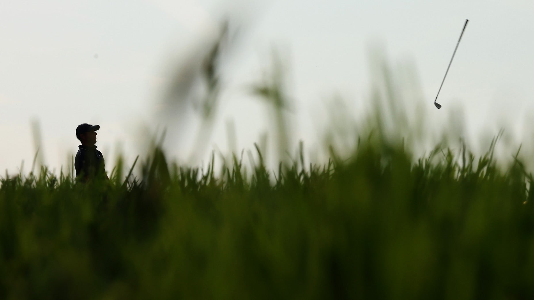 Rory McIlroy tosses his club down the 12th fairway during the second round of the 2025 U.S. Open at Oakmont Country Club.