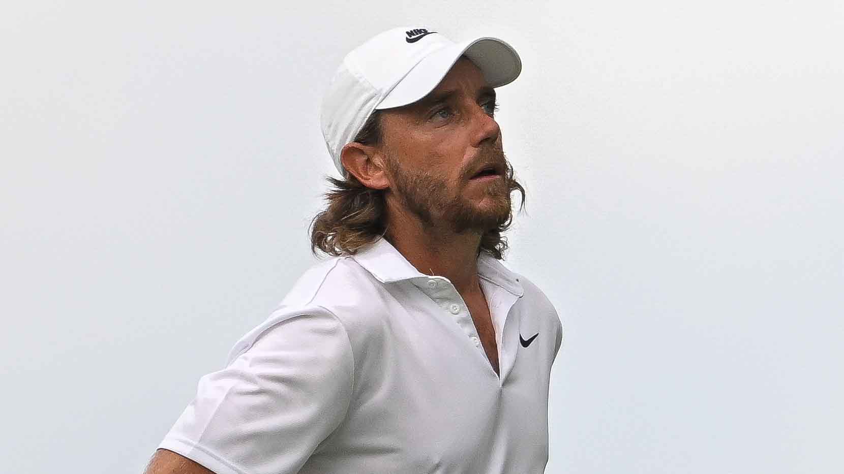 ommy Fleetwood of England walks on the 14th fairway during the final round of the Travelers Championship at TPC River Highlands