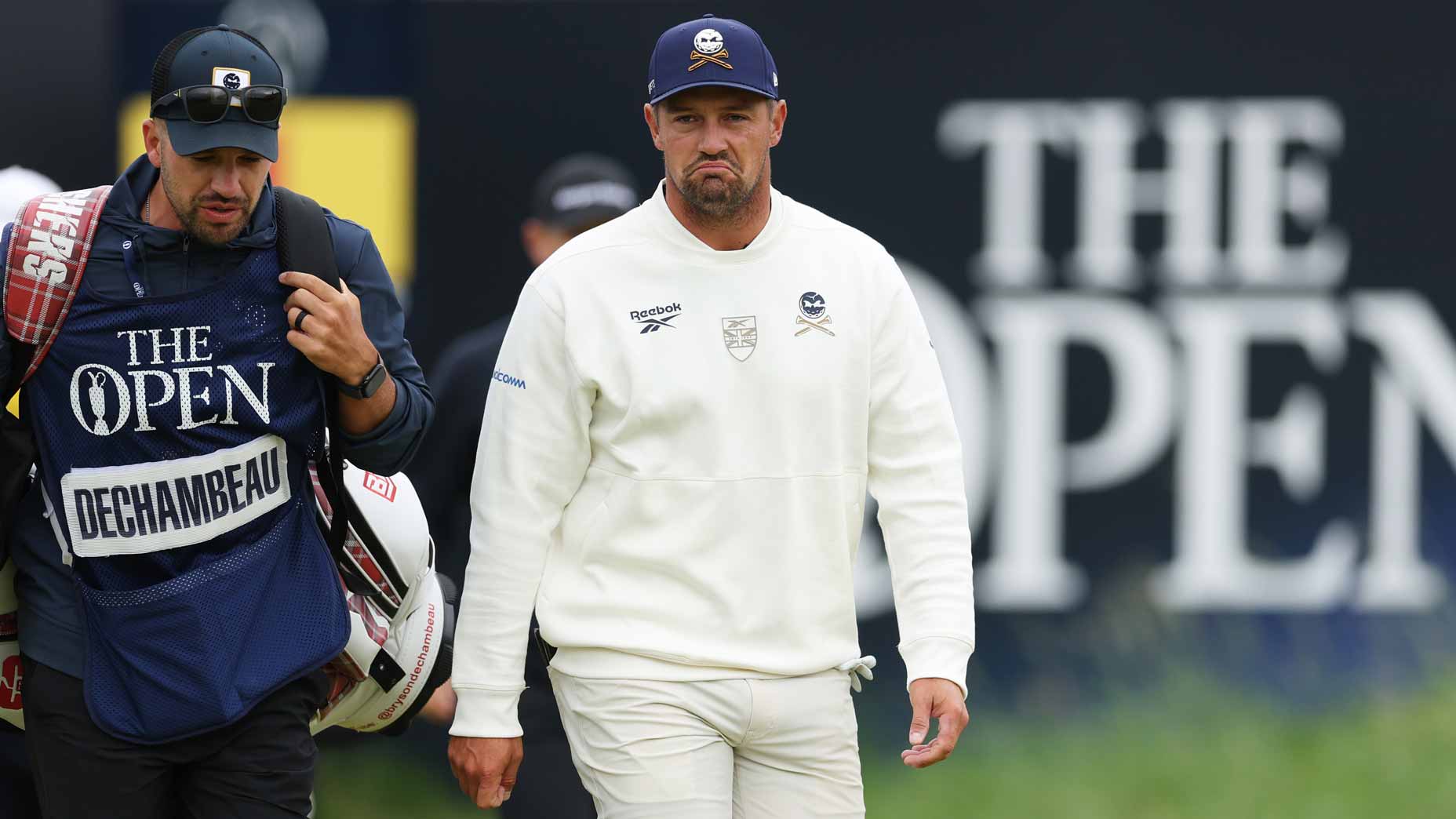 Bryson DeChambeau walks with his caddie during the 2025 Open Championship at Royal Portrush.