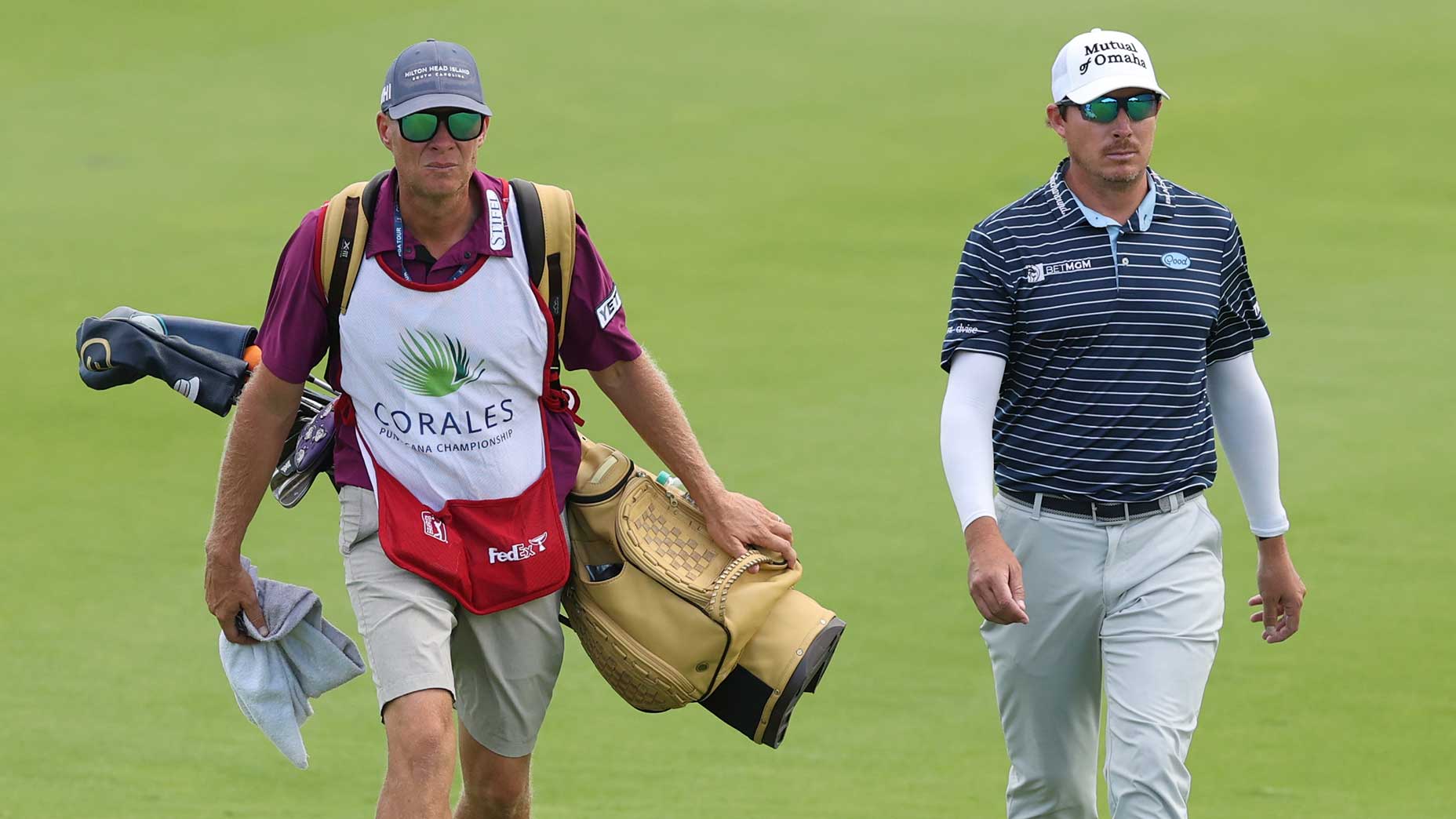 Joel Dahmen and Geno Bonnalie walk down the fairway during the Corales Puntacana Championship in April 2025.