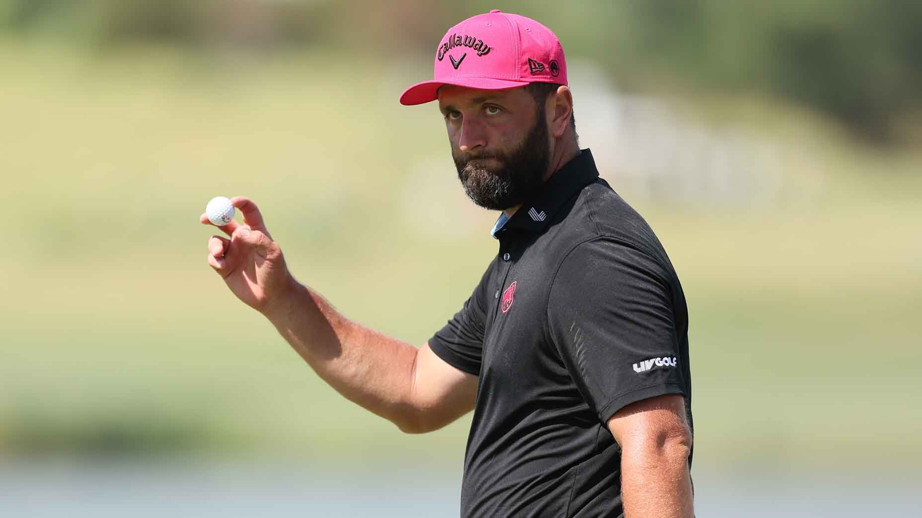 Jon Rahm acknowledges the crowd at LIV Dallas