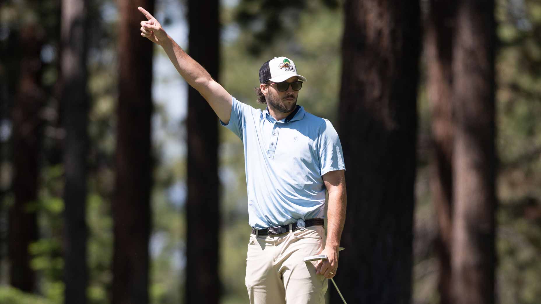 NFL star Josh Allen raises finger during 2025 ACC Celebrity Golf Championship.