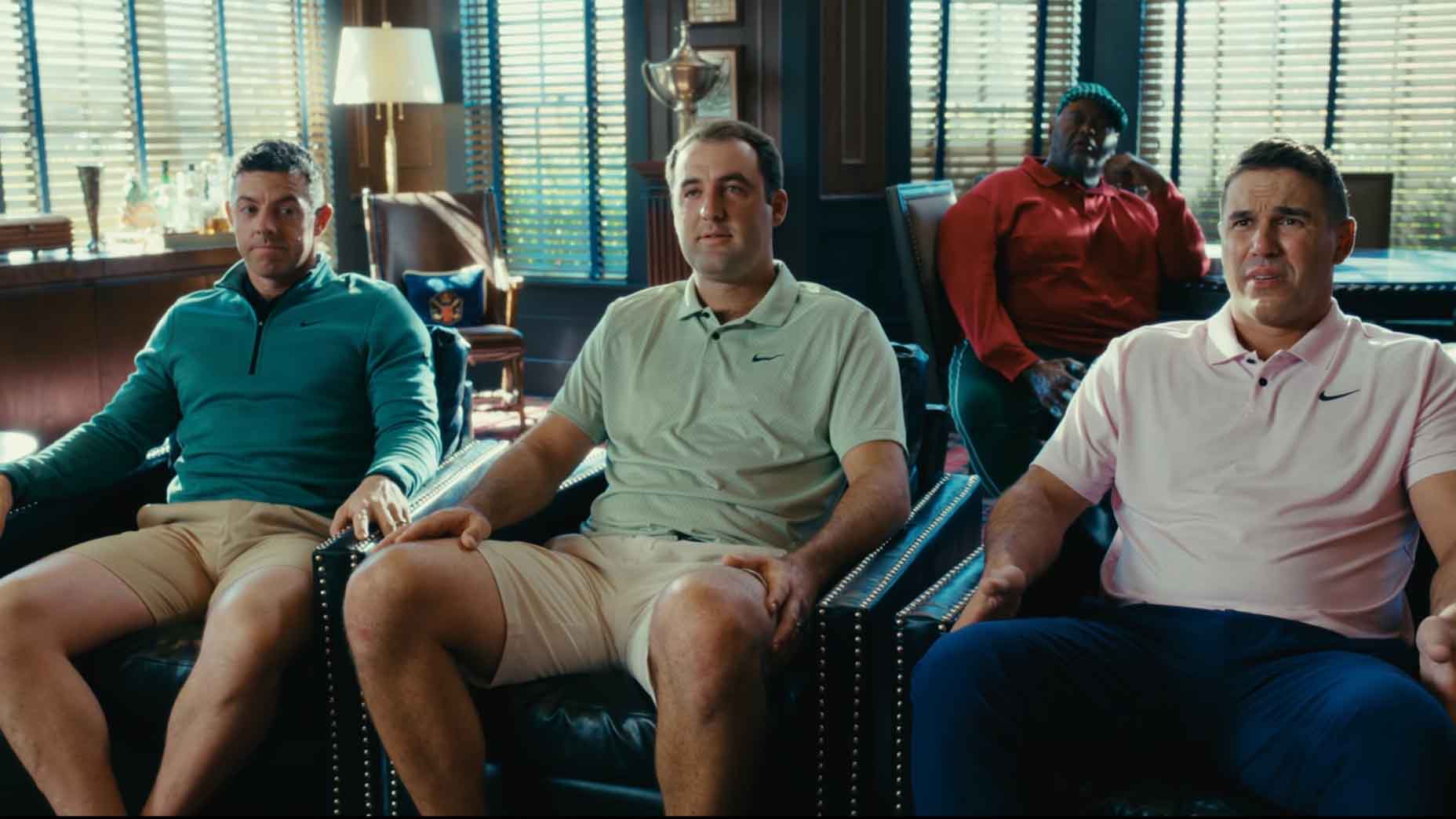 Scottie Scheffler, Rory McIlroy and Brooks Koepka sit during Happy Gilmore 2