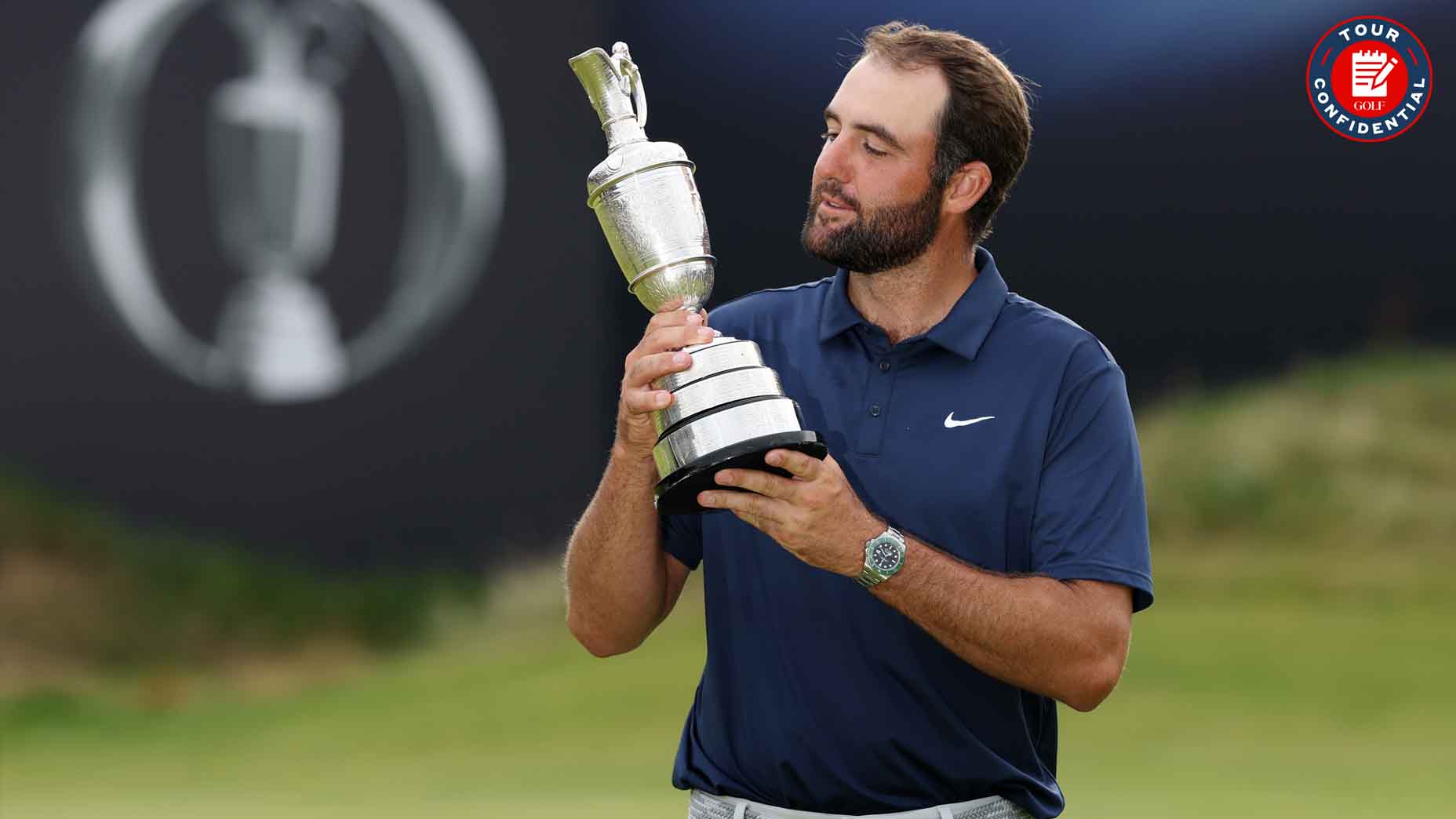Scottie Scheffler looks at the Claret Jug after winning the Open Championship
