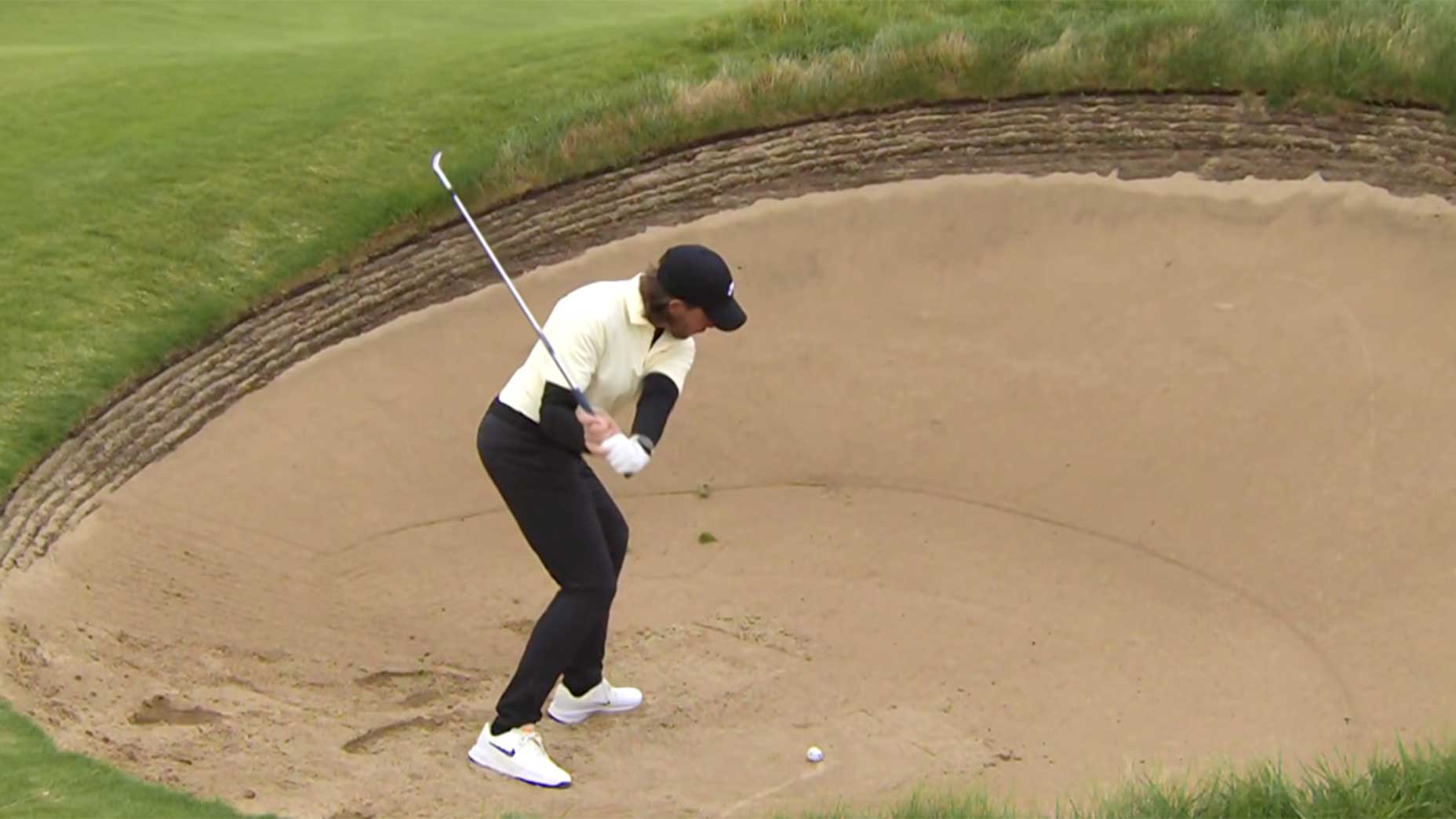 Tommy fleetwood plays out of a bunker during the first round of the open championship