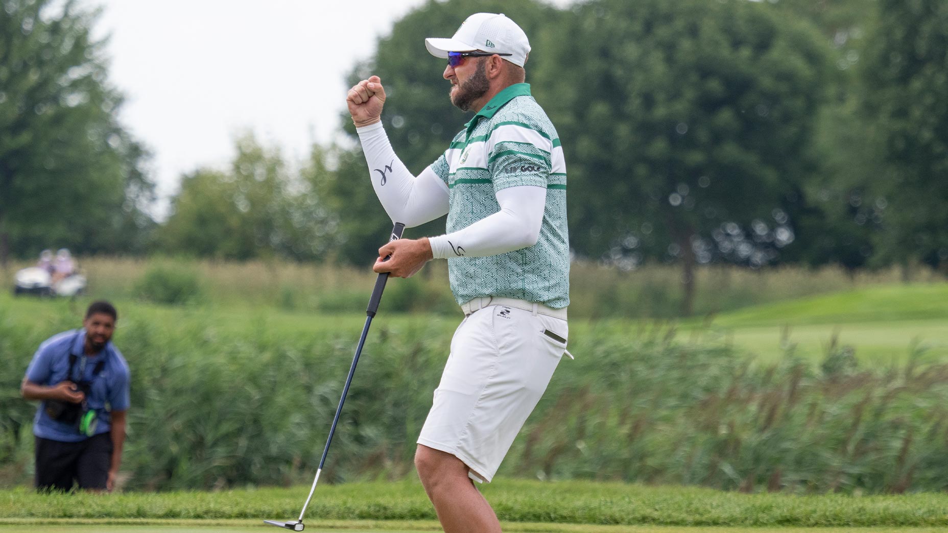 dean burmester pumps fist at LIV chicago in green shirt