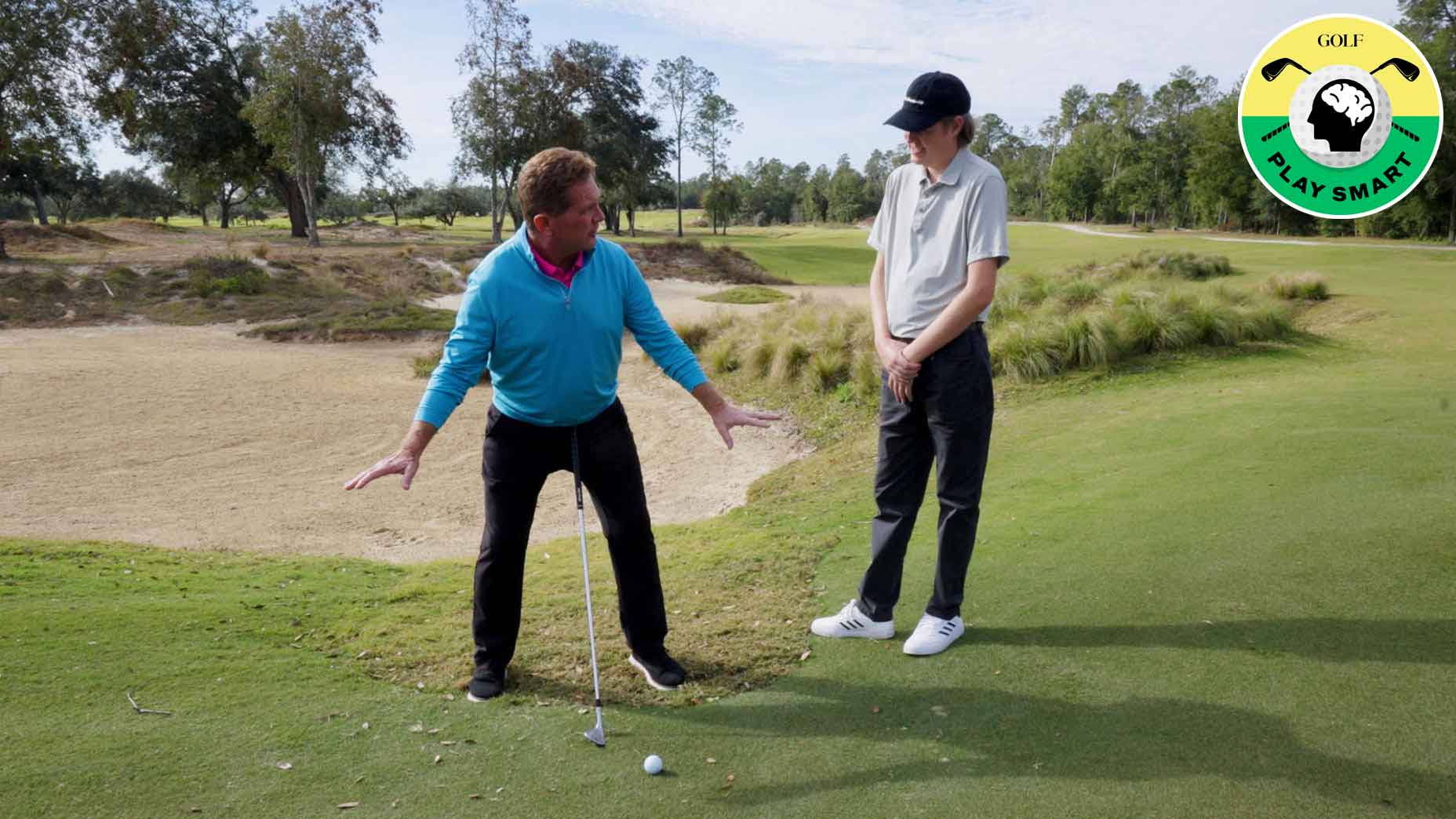 golf instructor demonstrates technique for student