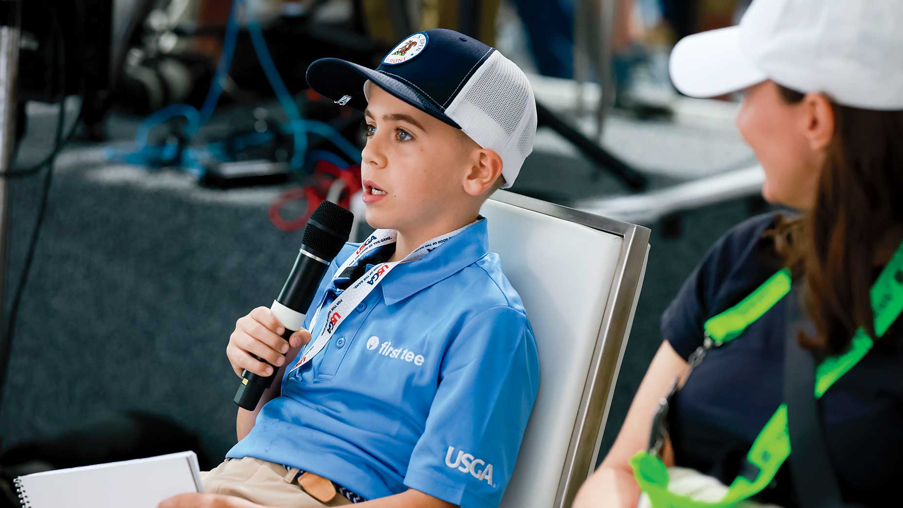 a kid reporter asks a question at the us open