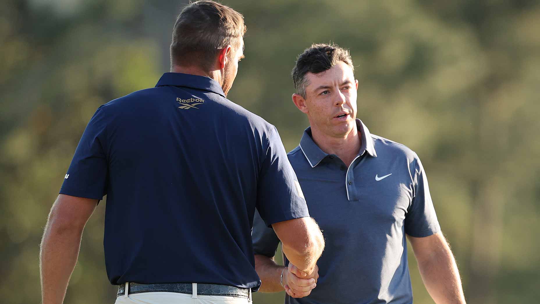 Rory McIlroy shakes hands with Bryson DeChambeau during final round of the 2025 Masters.