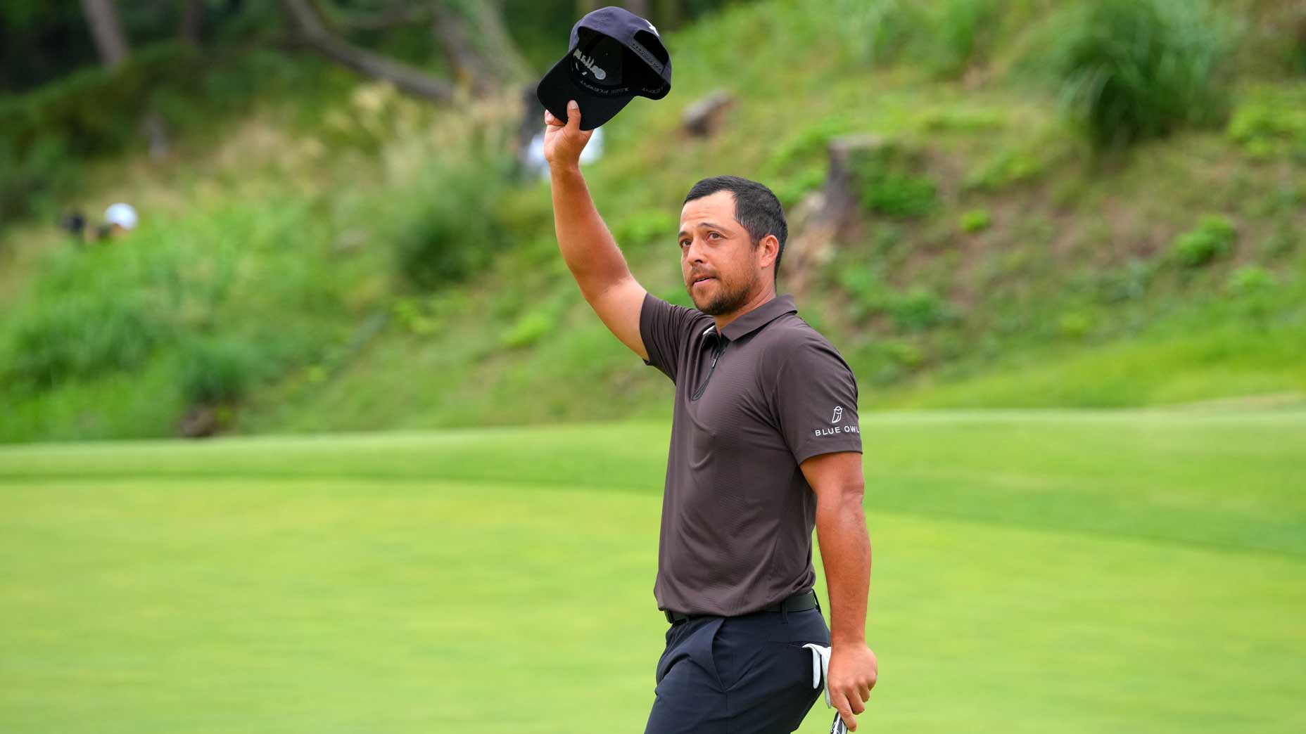 Xander Schauffele of the United States applauds the gallery after winning the tournament on the 18th green during the final round of the Baycurrent Classic Presented by LEXUS at Yokohama Country Club on October 12, 2025 in Yokohama, Kanagawa, Japan