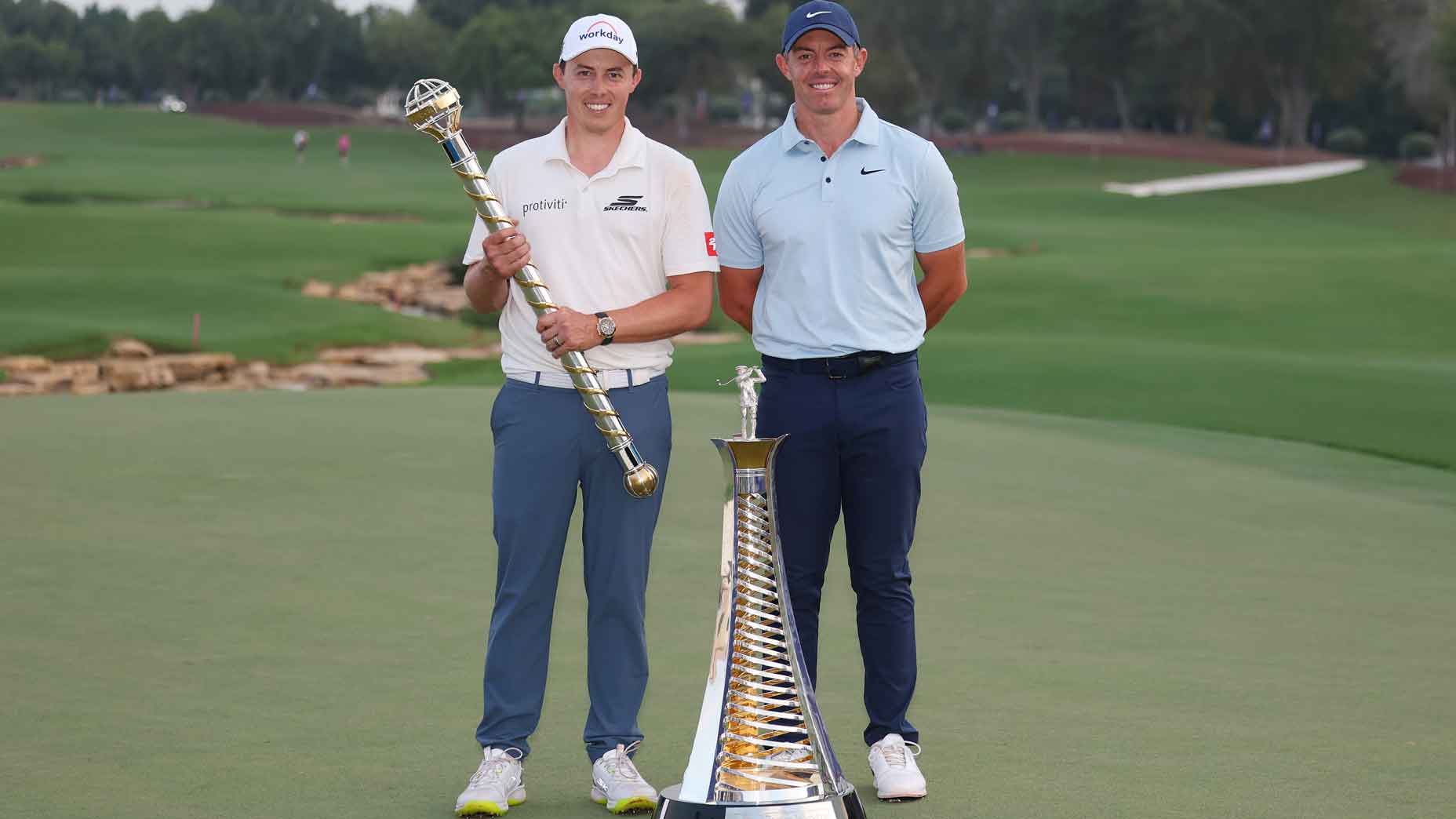 Matt Fitzpatrick of England and Rory McIlroy of Northern Ireland pose on the 18th green with the DP World Tour Championship and Race to Dubai trophies on day four of the DP World Tour Championship 2025 at Jumeirah Golf Estates on November 16, 2025 in Dubai, United Arab Emirates. (Photo by Andrew Redington/Getty Images)