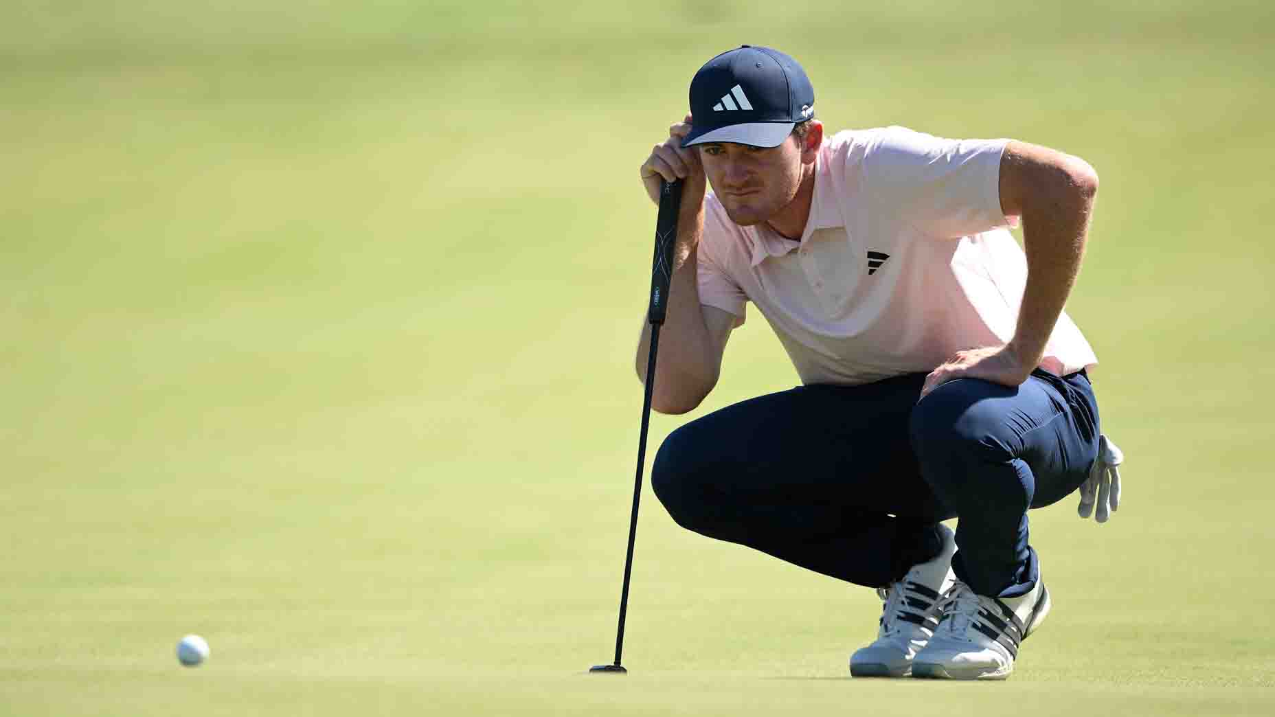Nick Dunlap surveys a putt during the World Wide Technology Championship