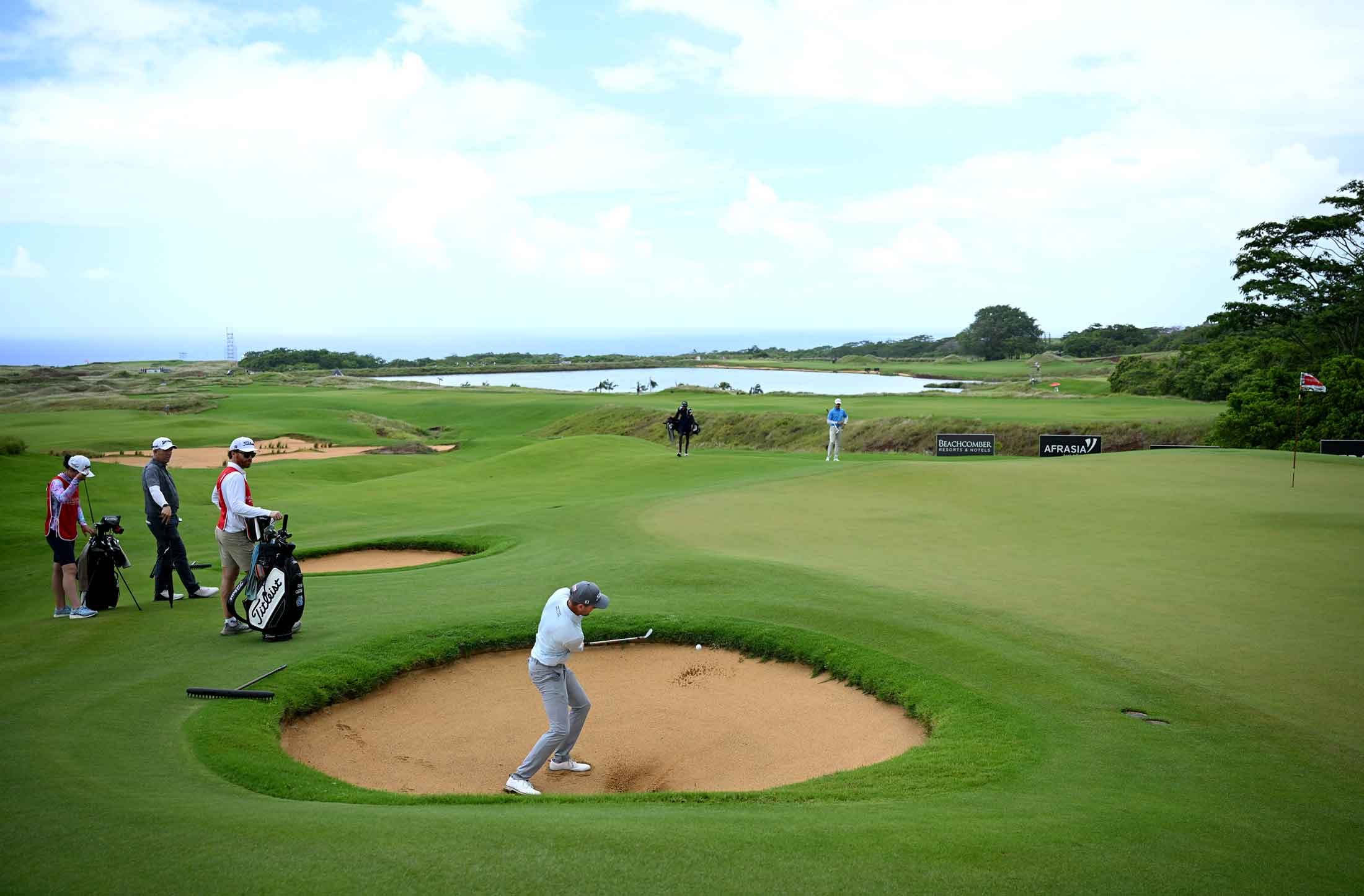 yan Gerard of the United States plays a shot from a greenside bunker on the eighth hole on day two of the AfrAsia Bank Mauritius Open 2026 at Heritage La Reserve Golf Club