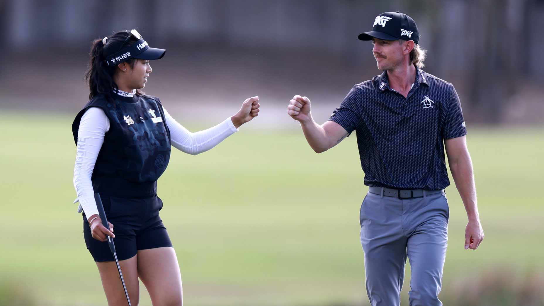 Patty Tavatanakit and Jake Knapp bump fists during the Grant Thornton Invitational.