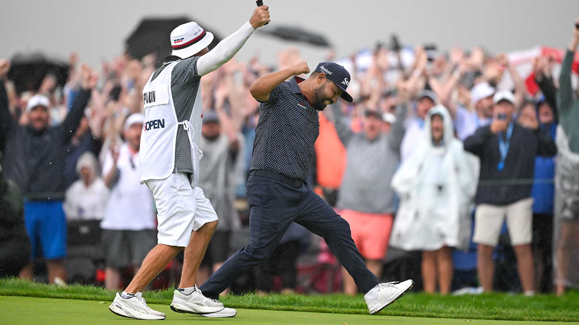 J.J. Spaun and caddie Mark Carens celebrate their U.S. Open title on June 15, 2025, in Oakmont, Pa.