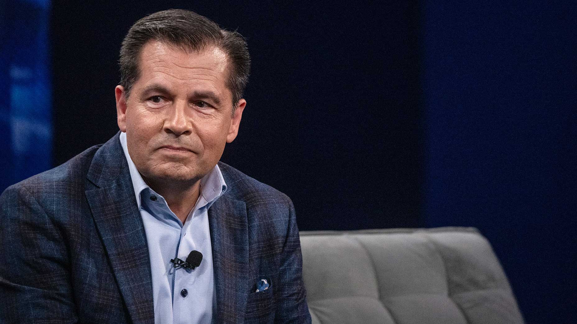 Derek Sprague looks on.