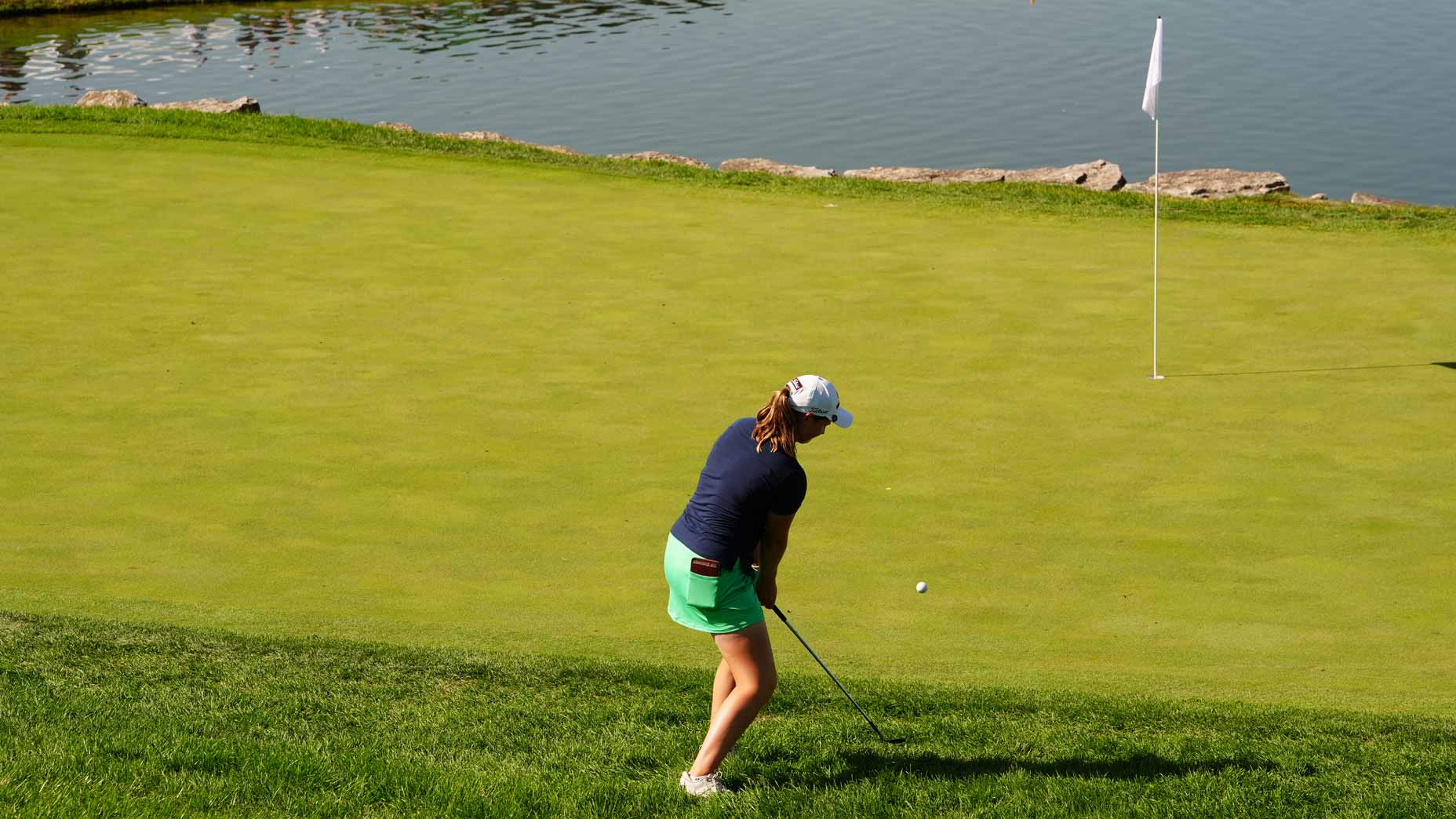 lottie woad hits a chip shot during the 2025 queen city championship