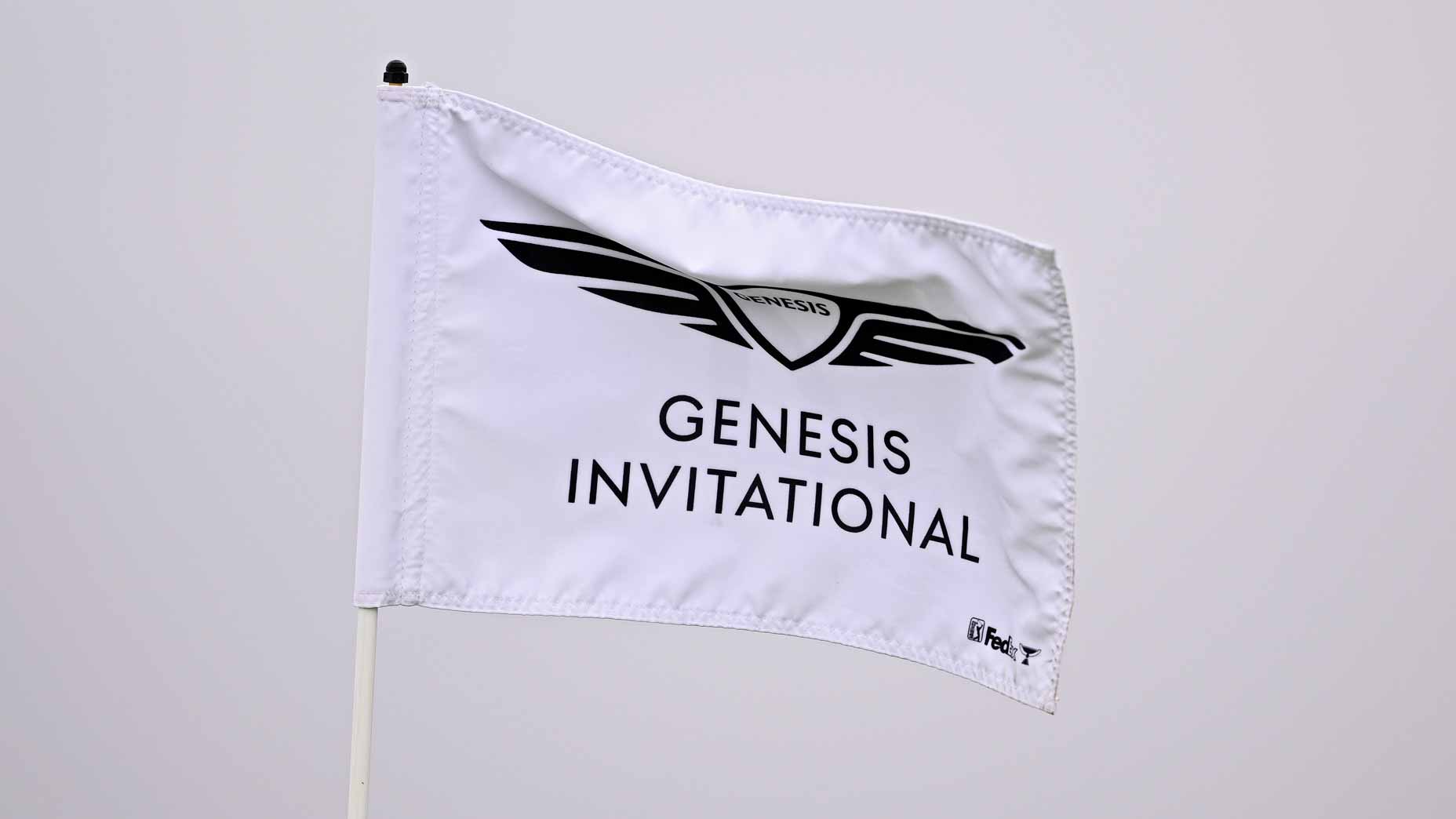 A white 2026 Genesis Invitational flagstick at PGA Tour event.