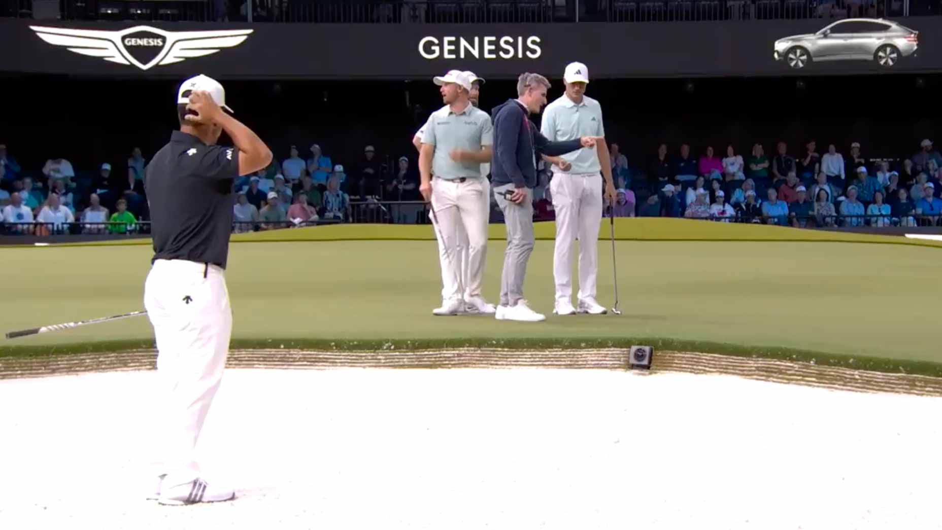 A rules official awards a mulligan to Xander Schauffele in a TGL match Tuesday night between New York and the Bay Golf Club.