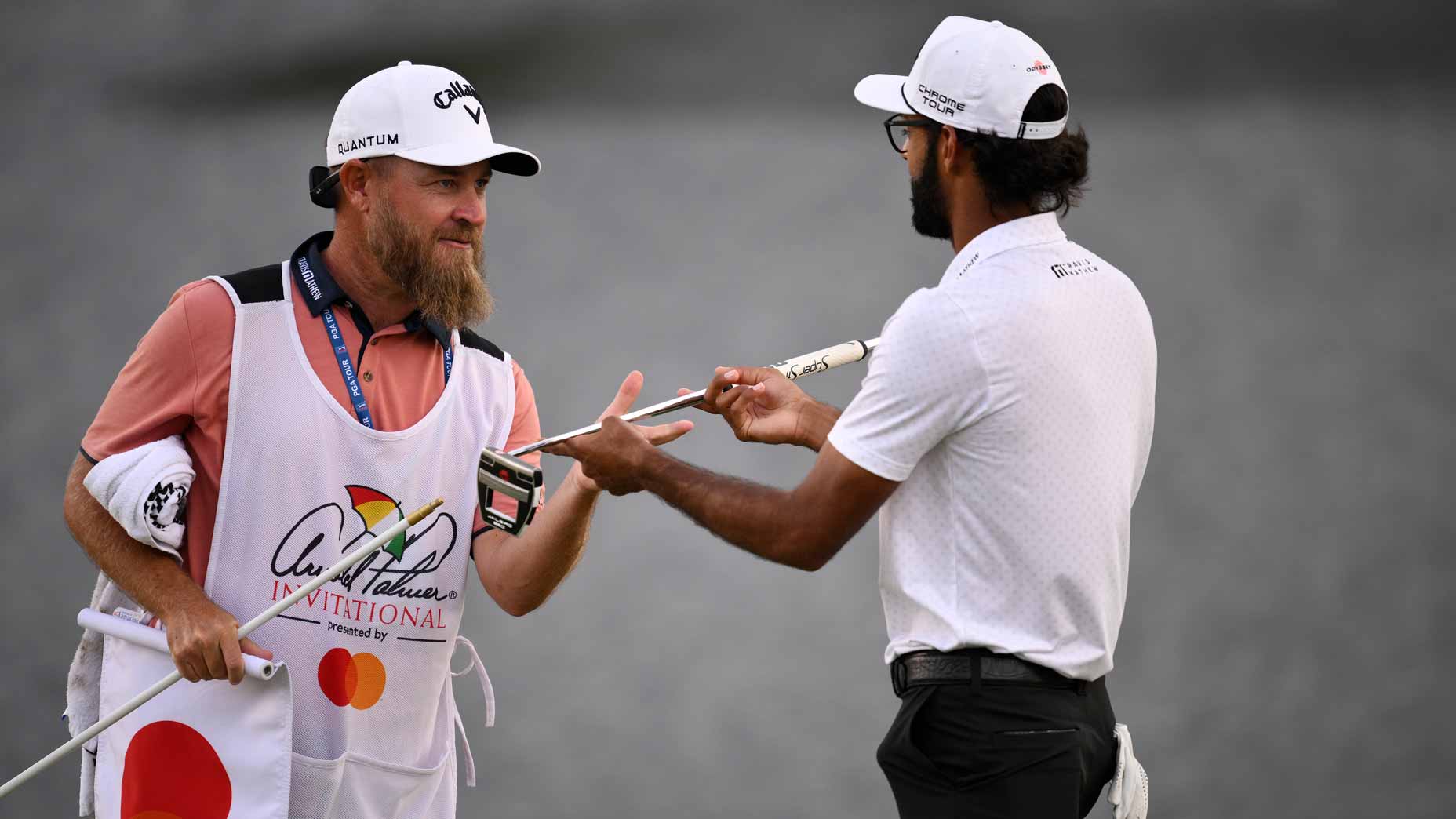 Akshay Bhatia of the United States celebrates with caddie Joe Greiner after winning the tournament on the eighteenth green during the first playoff hole at the Arnold Palmer Invitational presented by Mastercard 2026 at Arnold Palmer Bay Hill Golf Course on March 08, 2026 in Orlando, Florida.