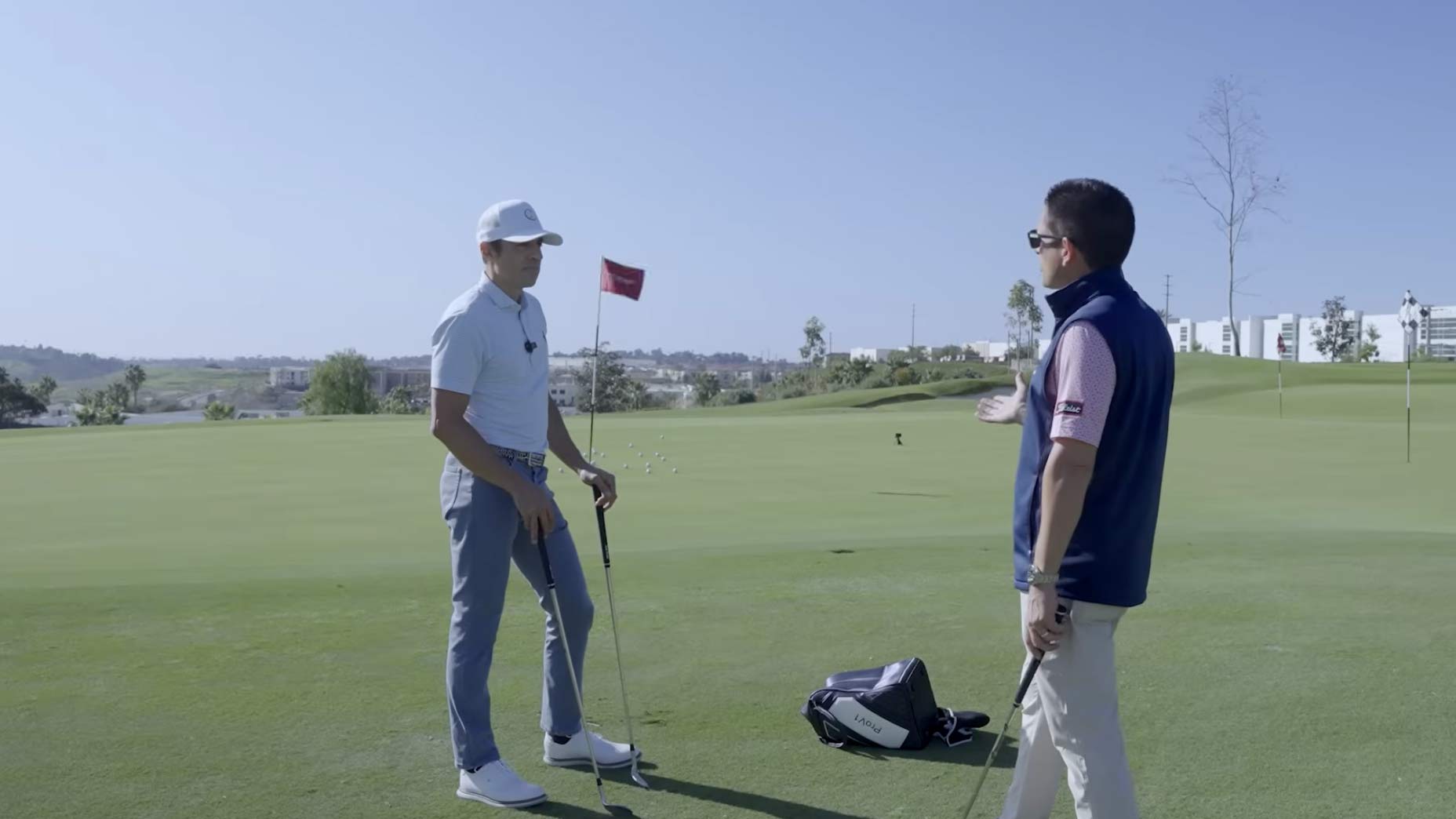 Johnny Wunder and Aaron Dill talk through a simple chip at TPI in Oceanside, Ca