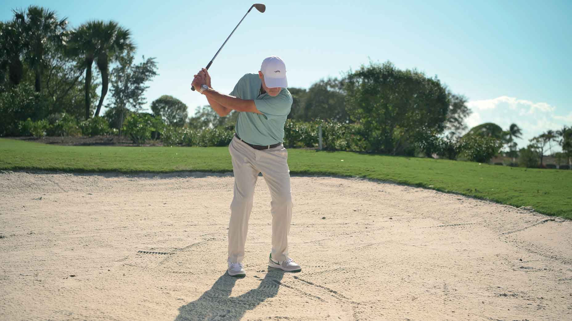 In any greenside bunker, the goal is to take sand and not worry about contacting the ball. A full swing helps too.