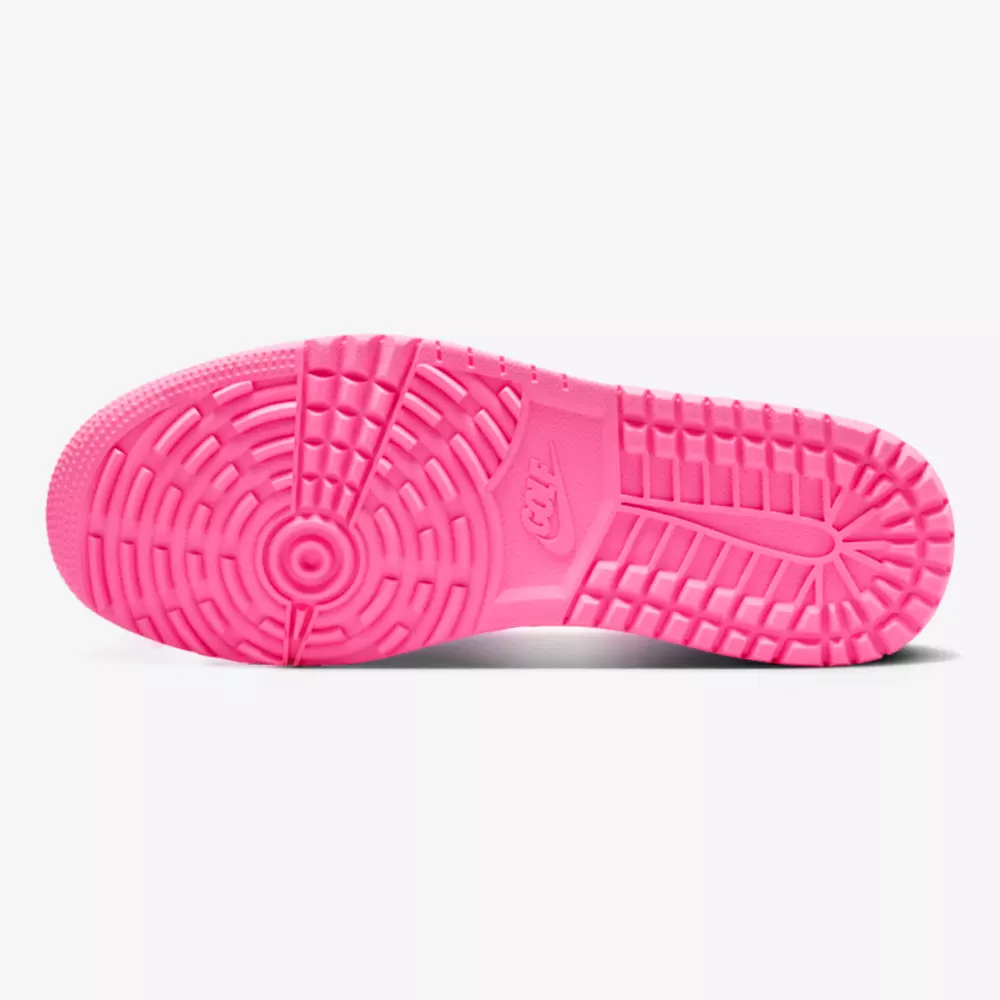 A bright pink sneaker outsole is displayed against a white background, featuring a circular tread pattern and textured details for grip—reminiscent of the traction found on the best Jordan golf shoes.