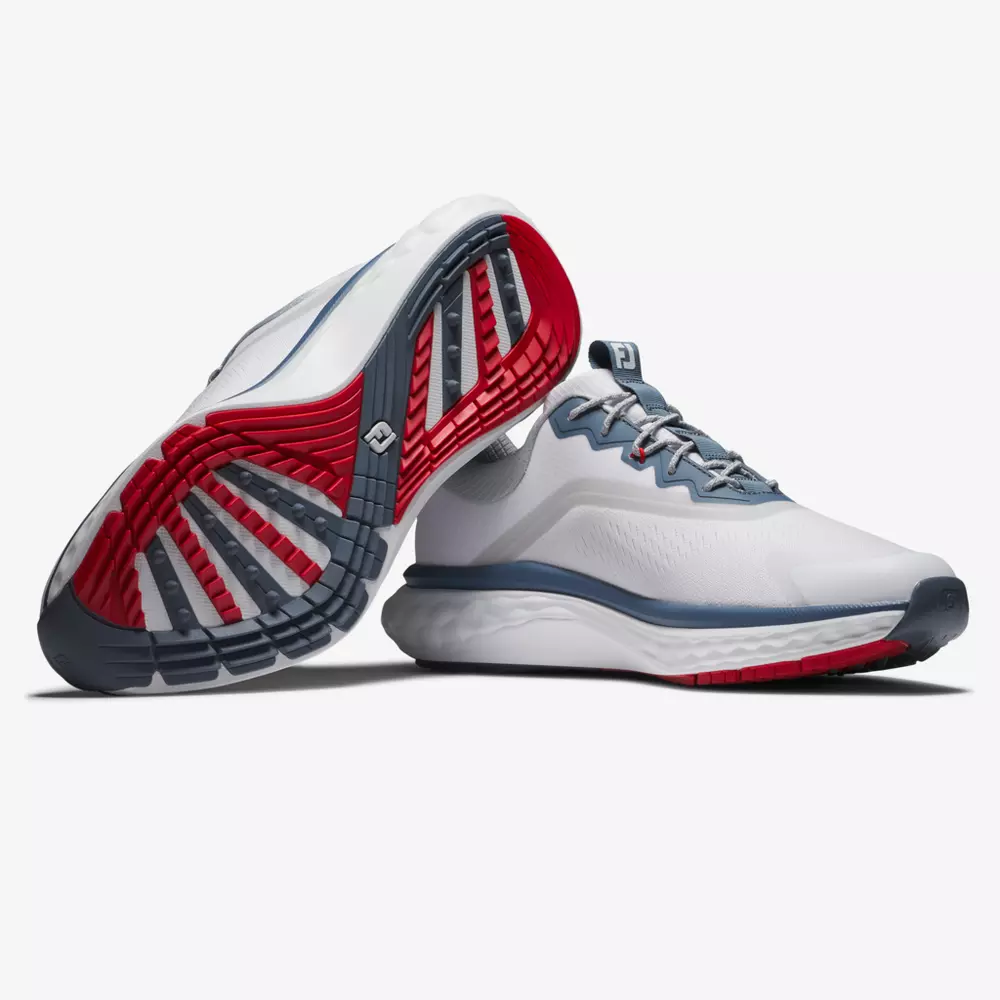 A pair of white athletic shoes with gray and red accents; one shoe is upright while the other is on its side, displaying the red and gray patterned sole—perfect contenders for best golf shoes 2026.