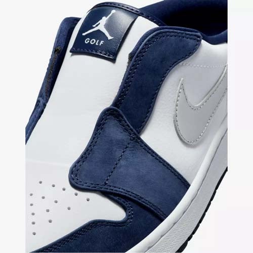 Close-up of one of the best Jordan golf shoes, the Nike Air Jordan in navy blue and white, featuring a gray Nike swoosh plus a label with the Jumpman logo and the word GOLF on the tongue.