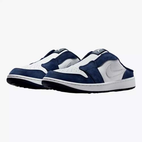 A pair of white and navy blue slip-on sneakers with a low back and Nike swoosh logo, displayed on a plain white background—perfect for those seeking comfort and style beyond the best Jordan golf shoes.