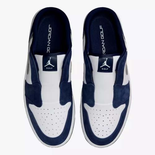 A pair of slip-on golf shoes in navy blue and white, viewed from above. These best Jordan golf shoes feature the Jumpman logo and the word GOLF on the tongue and insole, with perforated toe boxes and a sporty design.