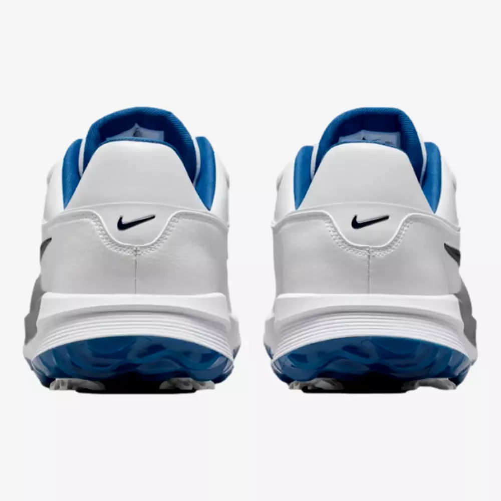 A pair of white athletic shoes with blue inner lining and black Nike swoosh logos on the heel, viewed from the back against a plain background—ideal for those seeking the best golf shoes 2026 has to offer.