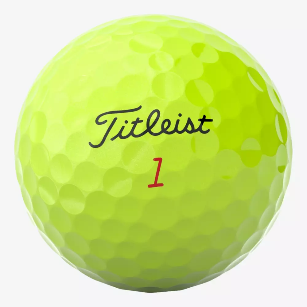 A yellow Titleist golf ball with the brand name Titleist in black script and the number 1 in red printed on it, pairing perfectly with the best golf shoes 2026. The surface features a dimpled texture.