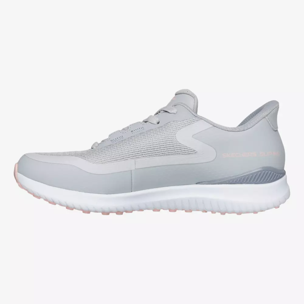 A light gray athletic sneaker with a white sole, mesh upper, and minimal design, branded with SKECHERS SLIP-INS on the heel&mdash;an inspired style for those seeking the best women's golf shoes 2026. Shown in a side profile on a white background.